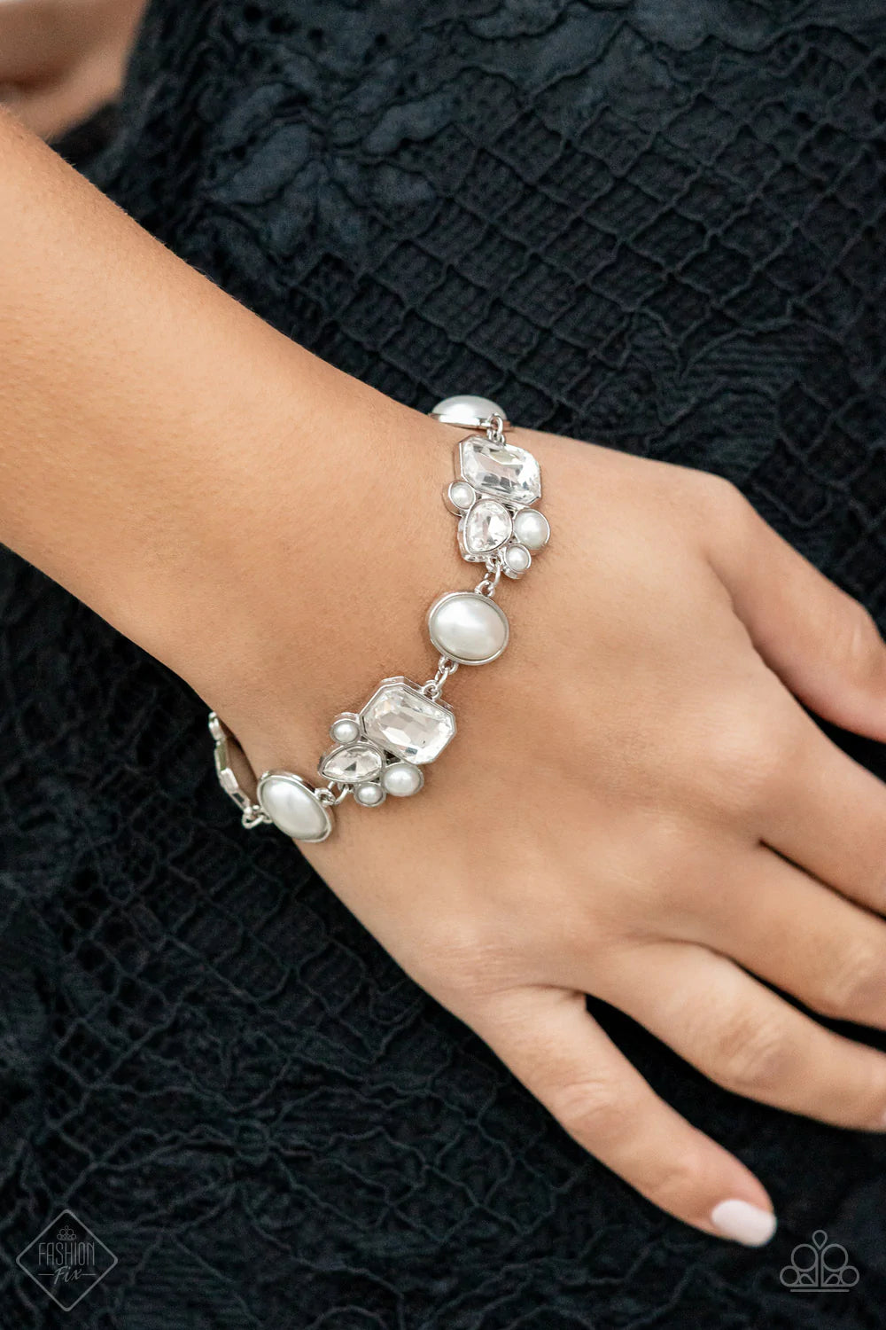 Paparazzi Accessories Best In SHOWSTOPPING - White Showstopping teardrop and emerald cut rhinestones, accented with bubbly pearl beads, coalesce into stunning asymmetrical frames. A trio of elegant white oval pearl beads delicately alternate with the asym