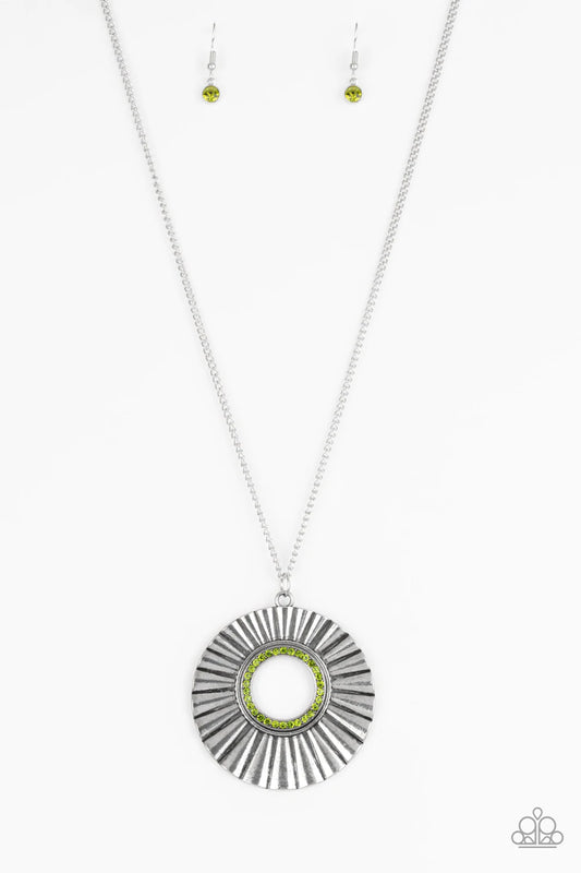 Paparazzi Accessories Chicly Centered - Green Brushed in a gritty antiqued finish, a rippling silver frame flares from a green rhinestone encrusted center for an edgy look. Features an adjustable clasp closure. Sold as one individual necklace. Includes on