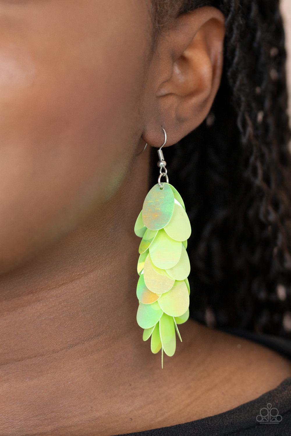 Paparazzi Accessories Stellar In Sequins - Green Featuring an iridescent shimmer, oversized oval green sequins cascade from the ear, creating a playful fringe. Earring attaches to a standard fishhook fitting. Sold as one pair of earrings. Jewelry