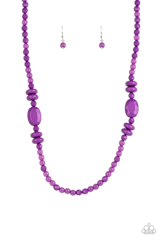 Paparazzi Accessories Tropical Tourist - Purple Varying in size, shape, and opacity, a vivacious purple collection of cloudy and solid acrylic beads drapes across the chest for a playful pop of color. Features an adjustable clasp closure. Sold as one indi