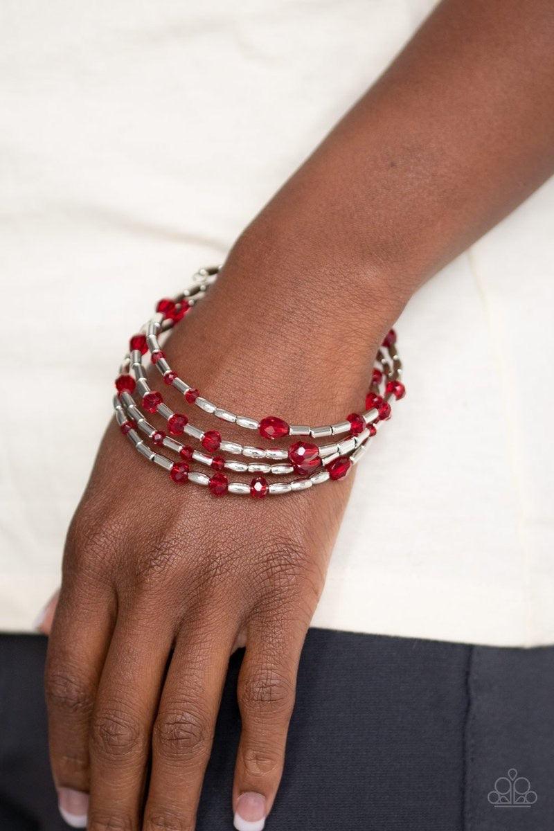 Paparazzi Accessories Regal Remix - Red Varying in size and shape, red crystal-like beads and glistening silver beads are threaded along a coiled wire, creating a regal infinity wrap style bracelet around the wrist. Sold as one individual bracelet. Jewelr