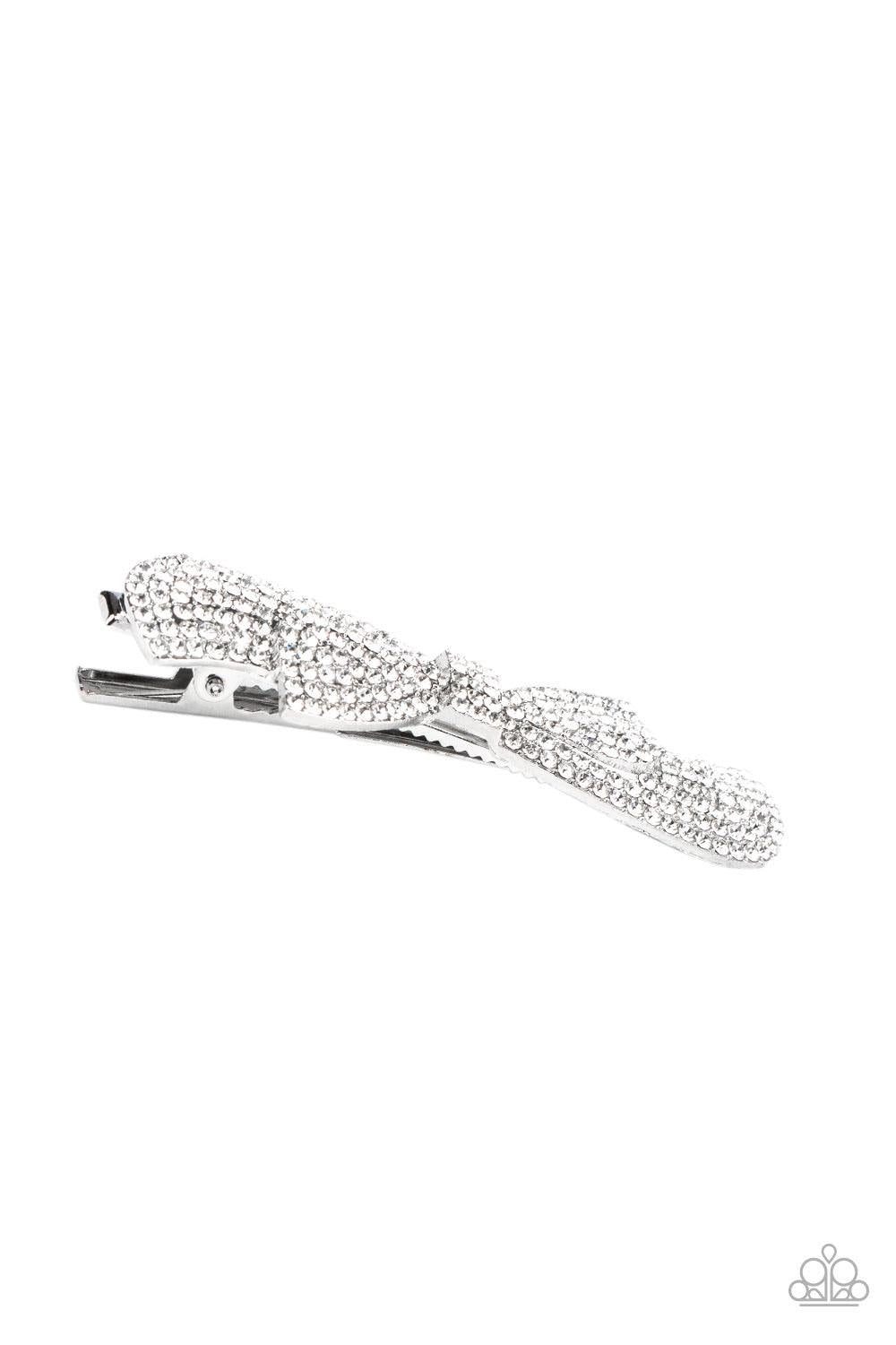 Paparazzi Accessories BOW Your Top Twinkle - White Encrusted in row after row of glassy white rhinestones, a ribbon shaped silver frame delicately stacks into a radiant bow for a timeless look. Features a standard hair clip on the back. Sold as one indivi