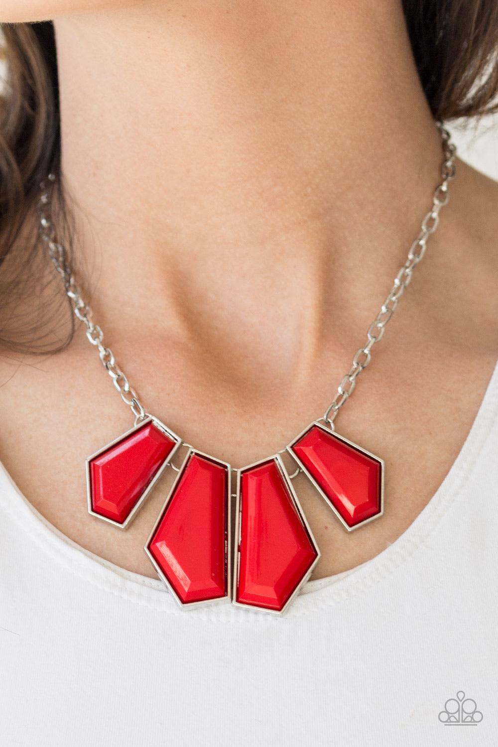 Paparazzi Accessories Get Up and GEO - Red Featuring emerald-style cuts, faceted red beads are pressed into sleek silver frames. The colorful frames join at the bottom of a shimmery silver chain, creating a bold geometric fringe below the collar. Features