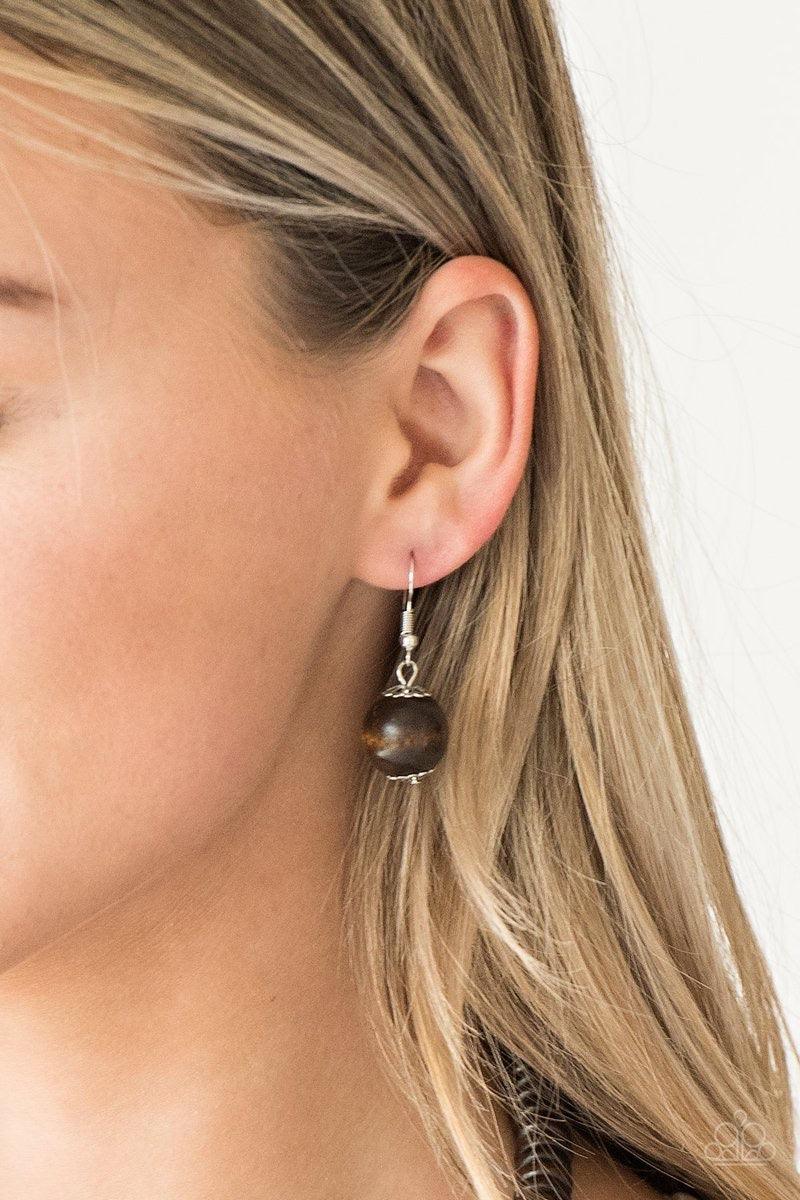 Paparazzi Accessories Caribbean Cover Girl - Multi Brushed in a distressed finish, vivacious pink and blue wooden beads and discs join below the collar for a summery look. Features a button loop closure. Jewelry