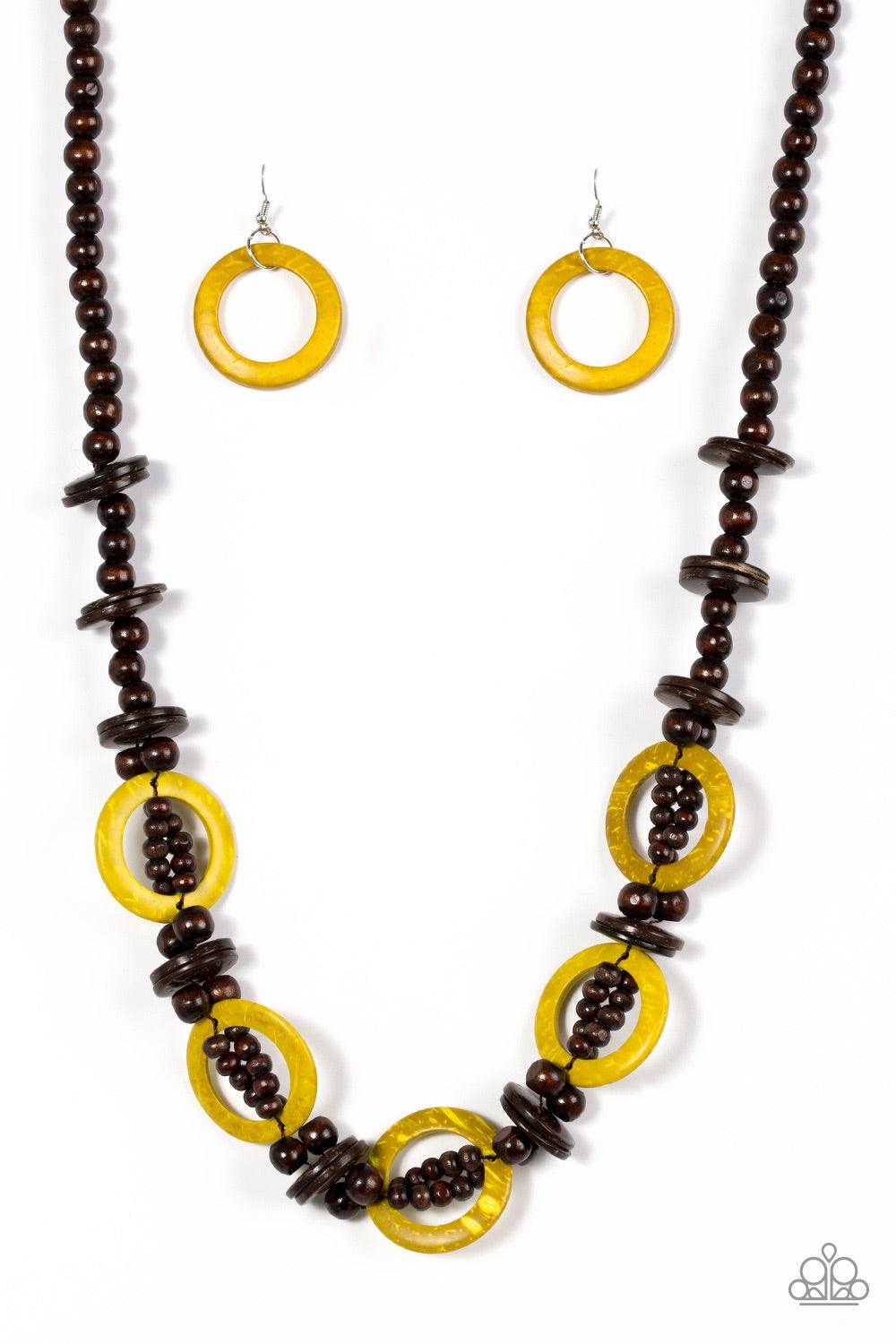 Paparazzi Accessories Fiji Foxtrot - Yellow Mismatched brown wooden beads are threaded along a brown cord for an earthy look. Sunny yellow wooden discs connect with beaded links across the chest for a summery finish. Jewelry