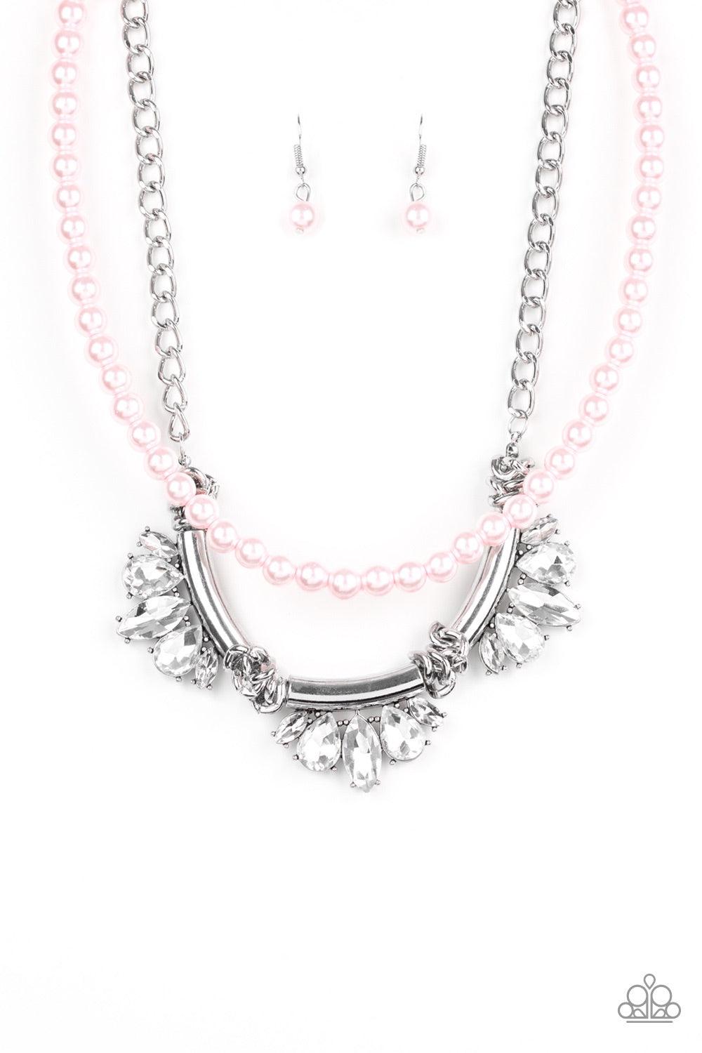 Paparazzi Accessories Bow Before The Queen - Pink A classic strand of pink pearls and dramatic silvery chain drape below the collar. Infused with heavy metal accents, teardrop and marquise cut white rhinestone frames connect into a show-stopping fringe. F