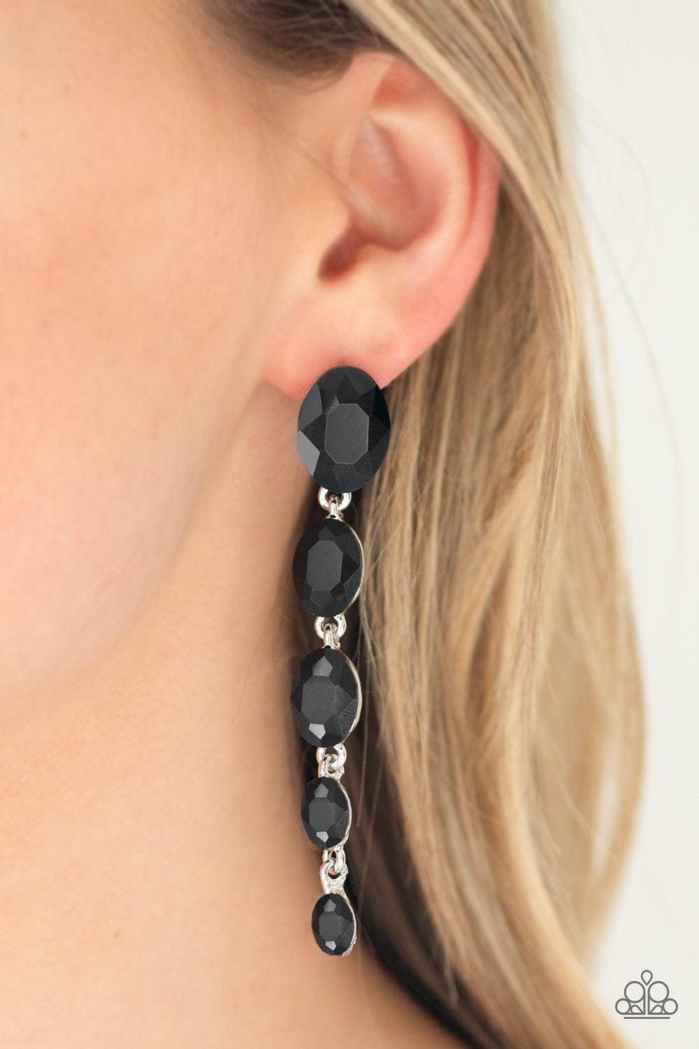Paparazzi Accessories Red Carpet Radiance - Black Gradually decreasing in size, glittery black gems trickle from the ear in a glamorous fashion. Earring attaches to a standard post fitting. Jewelry