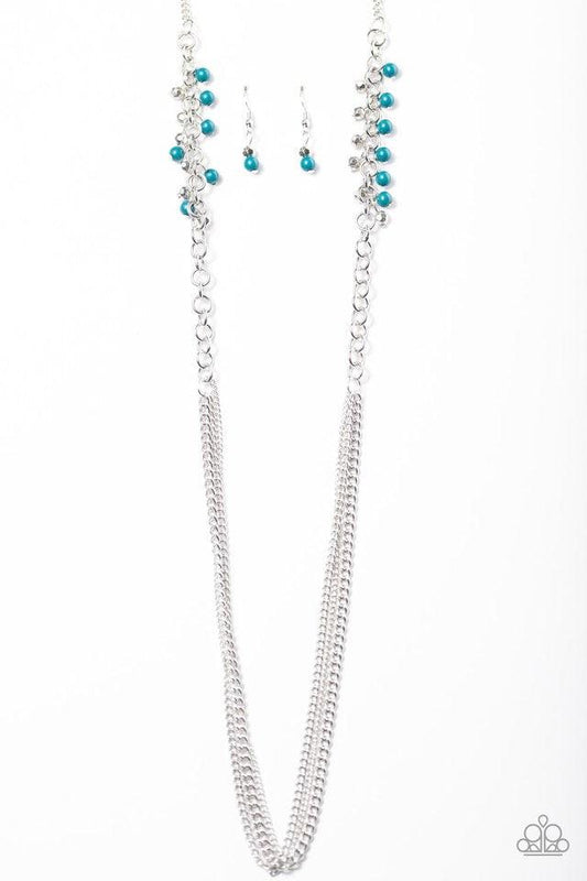 Paparazzi Accessories In For A Surprise - Blue Faceted silver and blue beading trickle along a bold silver chain. The colorful beading gives way to layers of mishmash silver chain, creating shimmery layers across the chest. Features an adjustable clasp cl