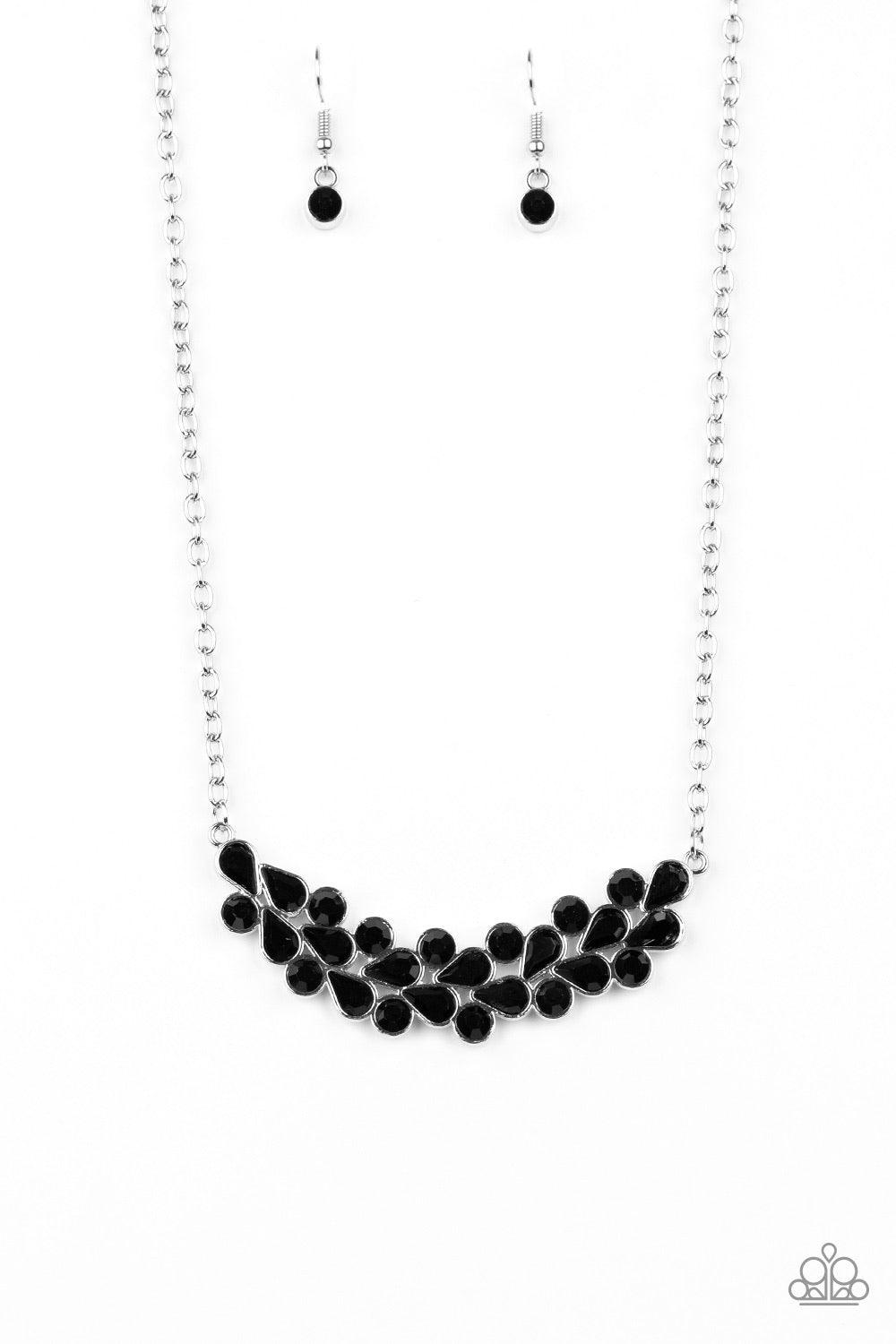 Paparazzi Accessories Special Treatment - Black A collection of round and teardrop black rhinestones coalesce into a bowing silver pendant below the collar for a refined look. Features an adjustable clasp closure. Jewelry