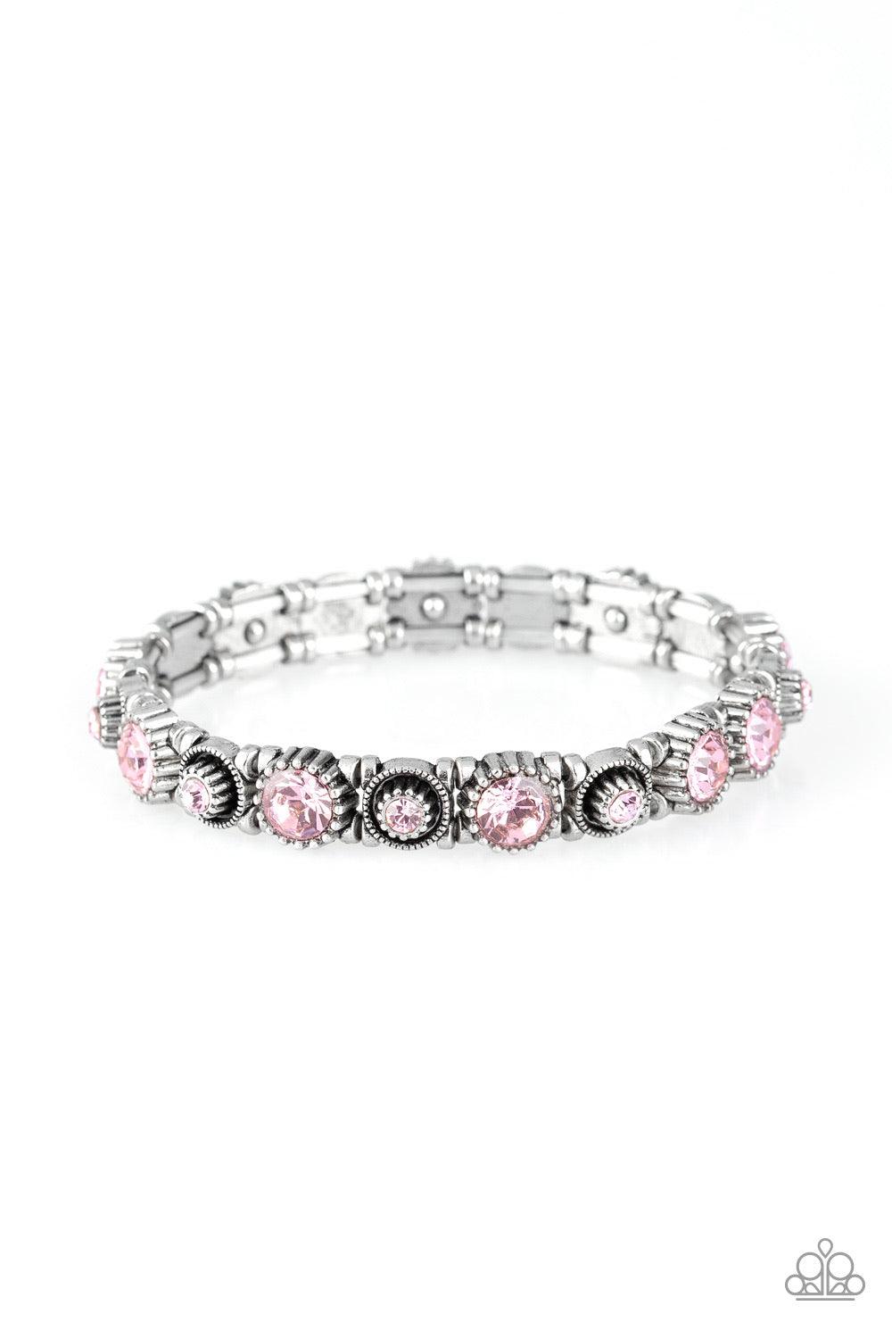 Paparazzi Accessories Heavy On The Sparkle - Pink Featuring glassy pink rhinestone centers, a collection of square silver frames slide along stretchy bands around the wrist for a glamorous look. Jewelry