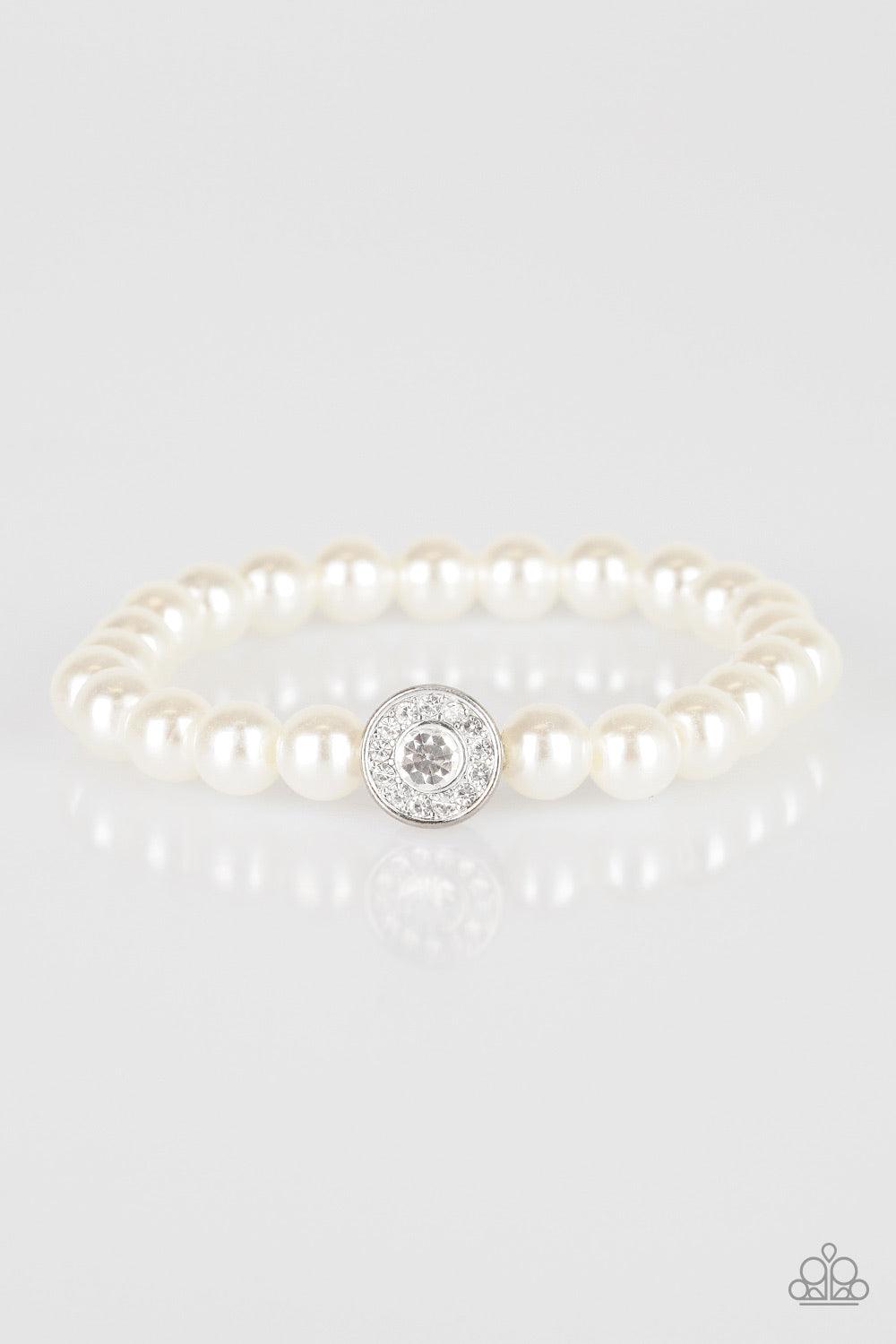 Paparazzi Accessories Follow My Lead - White White pearls and a white rhinestone encrusted silver charm are threaded along a stretchy band, creating a glamorous centerpiece atop the wrist. Jewelry