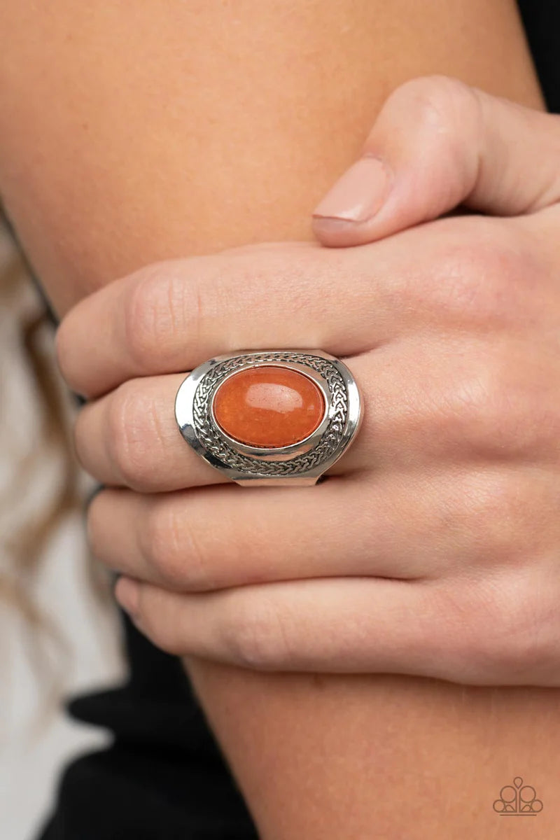 Paparazzi Accessories Rockable Refinement - Orange Bordered in a frame of chain-like details, an oval carnelian stone is pressed into the center of an oval silver frame as it folds around the finger for an enchantingly earthy look. Features a stretchy ban