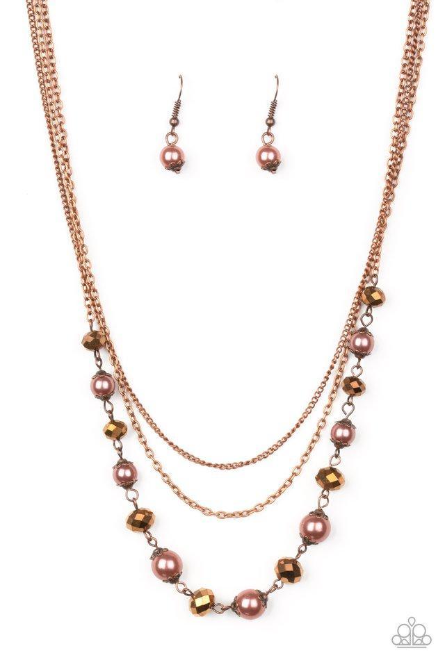 Paparazzi Accessories Tour de Demure - Copper Infused with two layers of dainty copper chains, pearly copper beads and coppery aurum rhinestones link below the collar for a demure look. Features an adjustable clasp closure. Sold as one individual necklace