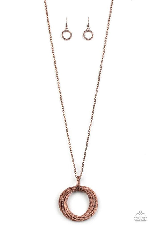 Paparazzi Accessories Metal Marathon - Copper Featuring a hammered finish, a collection of interlocking copper hoops are threaded through the center of textured copper fittings. The dizzying pendant swings from the bottom of a lengthened copper chain for