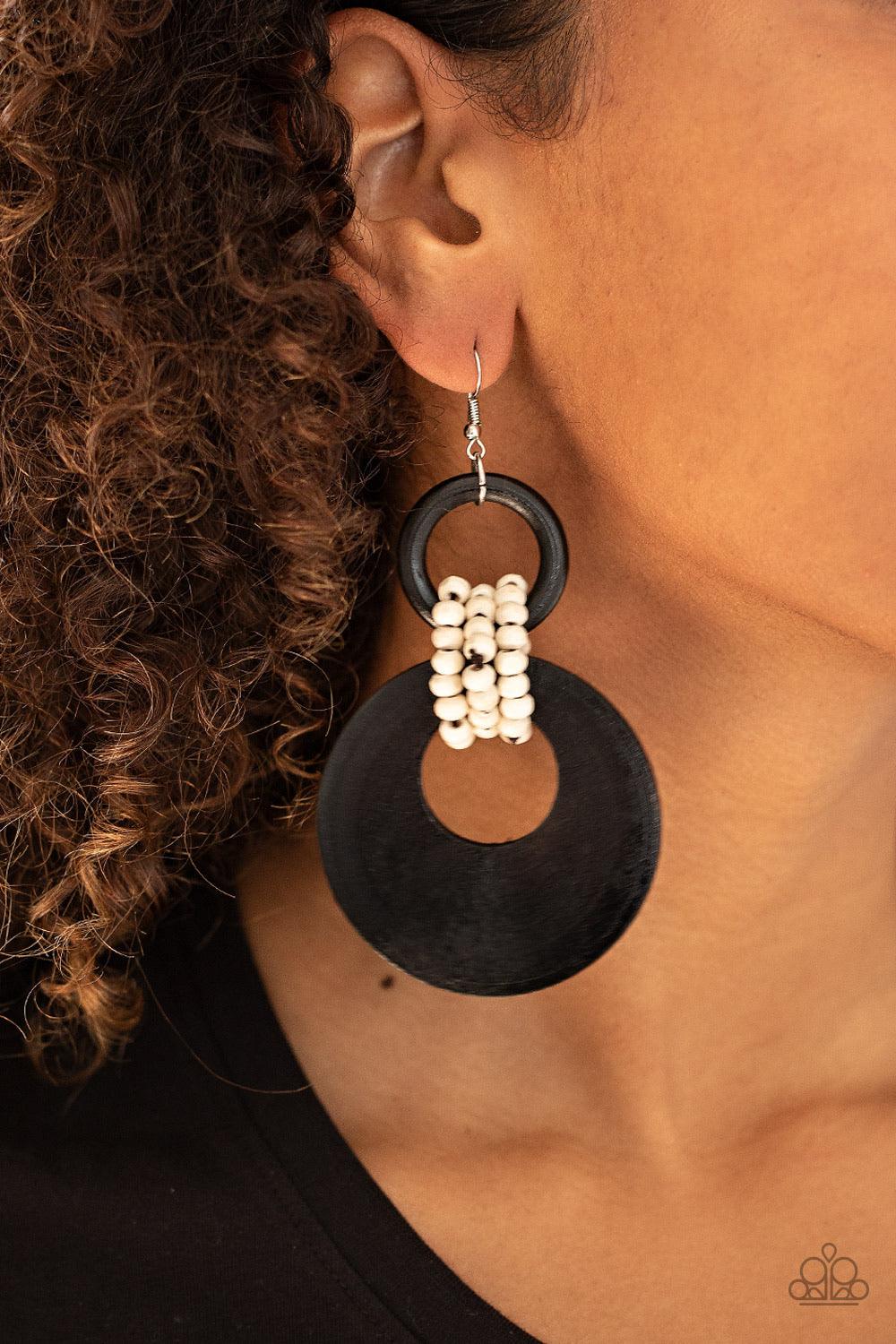 Paparazzi Accessories Beach Day Drama - Black White wooden beaded links connect together a black wooden ring and an oversized black wooden crescent-like hoop, creating a uniquely earthy lure. Earring attaches to a standard fishhook fitting. Sold as one pa