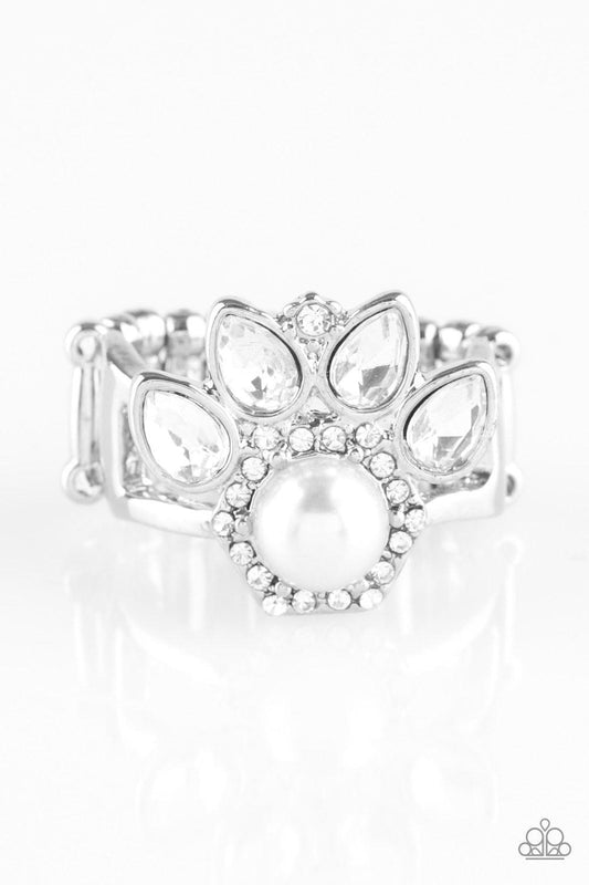Paparazzi Accessories Crown Coronation - White Featuring regal teardrop cuts, glittery white rhinestones flare from the center of a white pearl drop center. Dainty white rhinestones spin around the pearly center for a glamorous finish. Features a stretchy