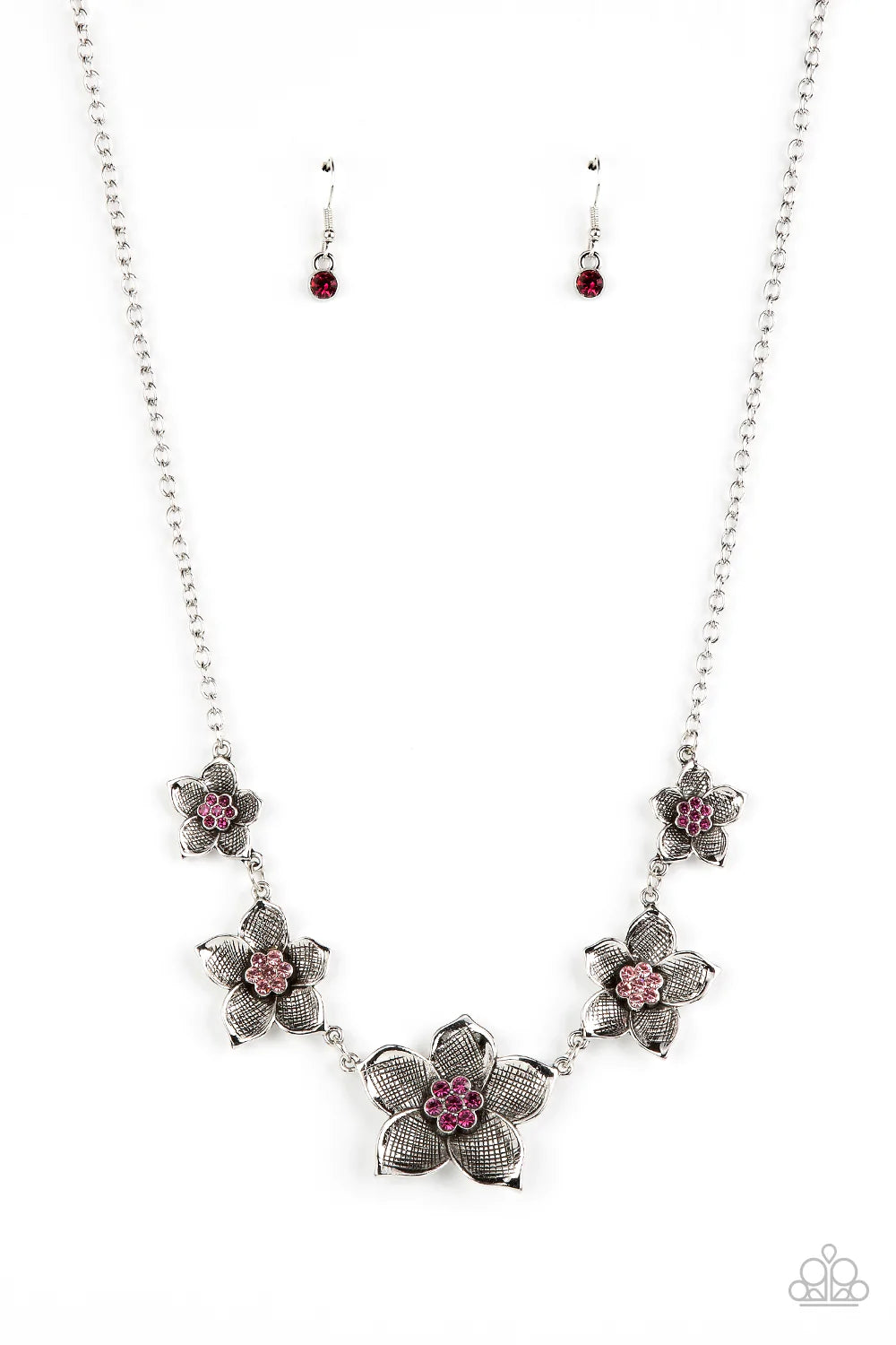 Paparazzi Accessories Wallflower Wonderland - Pink A charming collection of antiqued silver flowers in diminishing sizes delicately link across the collar. The detailed petals are etched in antiqued silver and fan out from lovely pink rhinestone centers r