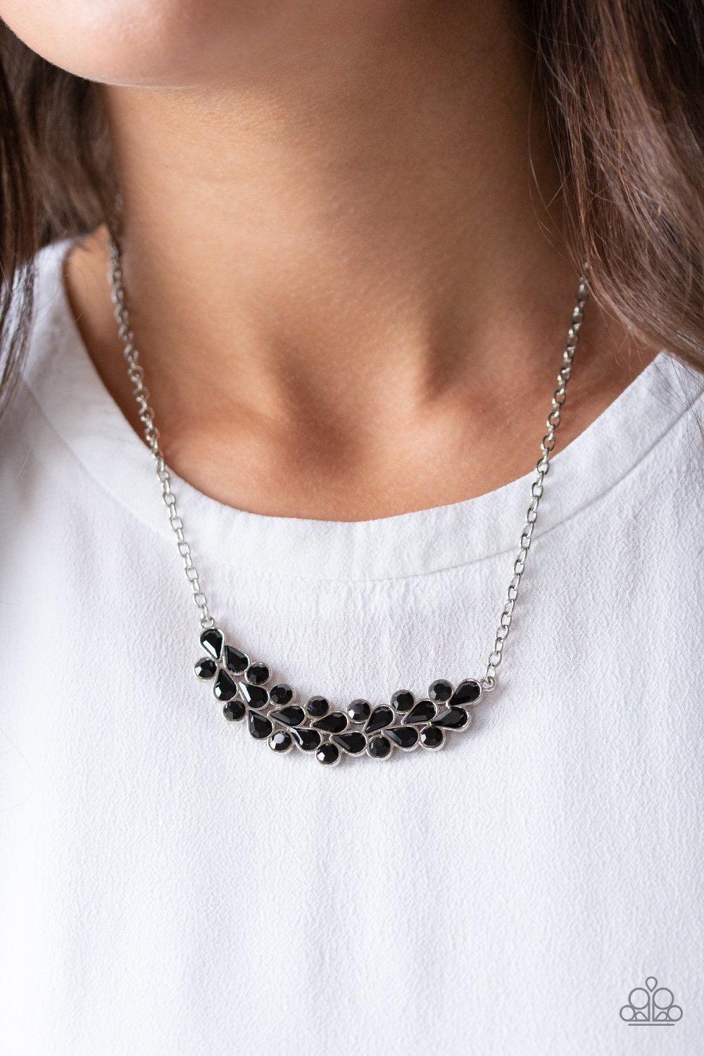 Paparazzi Accessories Special Treatment - Black A collection of round and teardrop black rhinestones coalesce into a bowing silver pendant below the collar for a refined look. Features an adjustable clasp closure. Jewelry