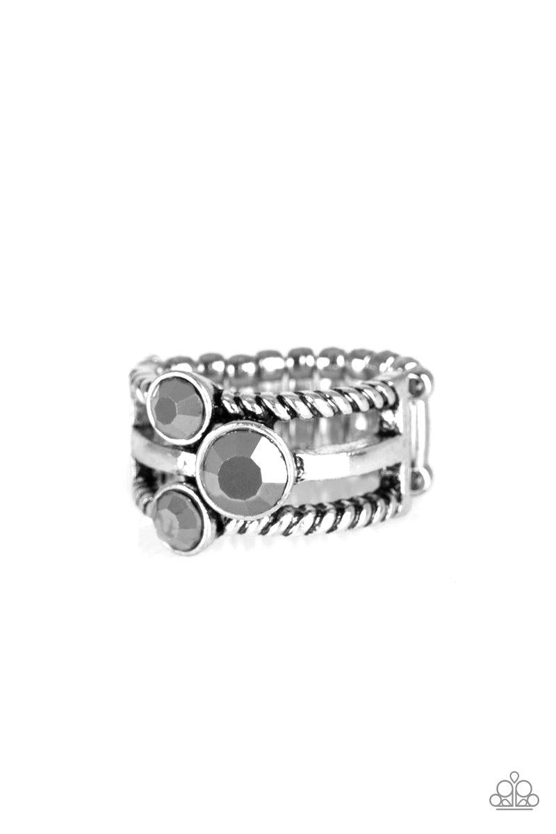 Paparazzi Accessories Head in the Stars - Silver A trio of glittery hematite rhinestones are sprinkled along smooth and twisted silver bands, creating edgy layers across the finger. Features a stretchy band for a flexible fit. Sold as one individual ring.