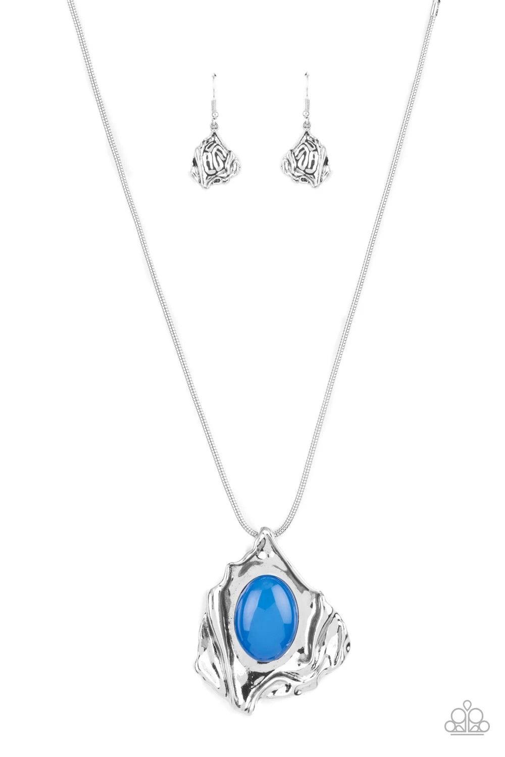 Paparazzi Accessories Amazon Amulet - Blue A glassy blue oval bead is pressed into the center of an abstract silver frame below the collar, creating a colorful artisan inspired pendant at the bottom of a rounded silver snake chain. Features an adjustable