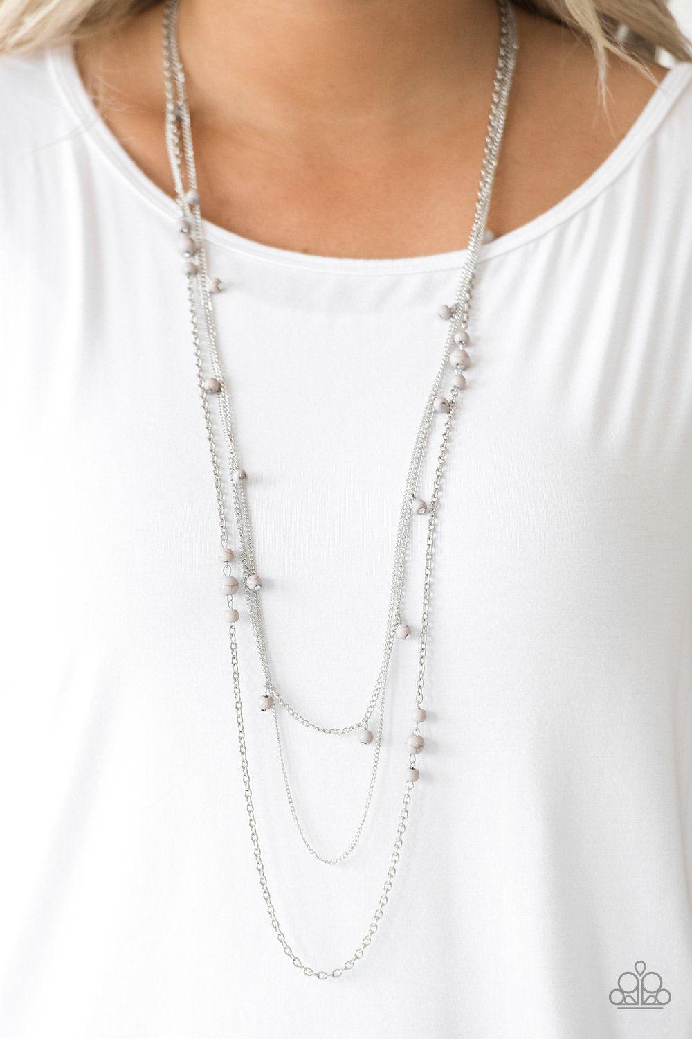 Paparazzi Accessories Laying The Groundwork - Silver Infused with a plain silver chain, mismatched gray stone beads sporadically trickle along shimmery silver chains, creating earthy layers down the chest. Features an adjustable clasp closure. Sold as one