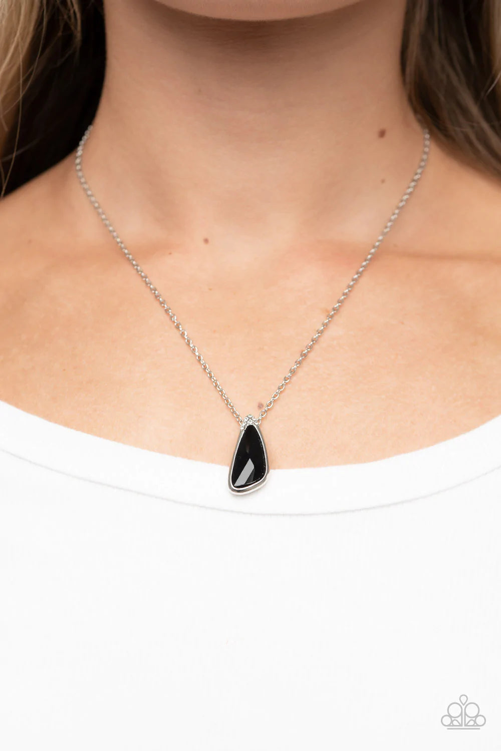 Paparazzi Accessories Envious Extravagance -Black An asymmetrical black gem is pressed into a shiny silver frame dusted in glassy white rhinestones, resulting in a refined pendant at the bottom of a dainty silver chain. Features an adjustable clasp closur