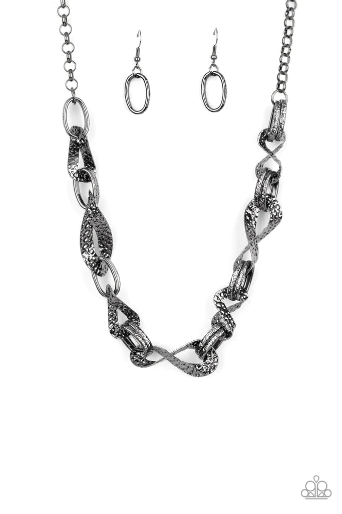 Paparazzi Accessories METAL of Honor - Black Hammered and embossed in geometric detail, pairs of gunmetal links connect with twisting gunmetal oval fames below the collar for an edgy, but refined look. Features an adjustable clasp closure. Sold as one ind
