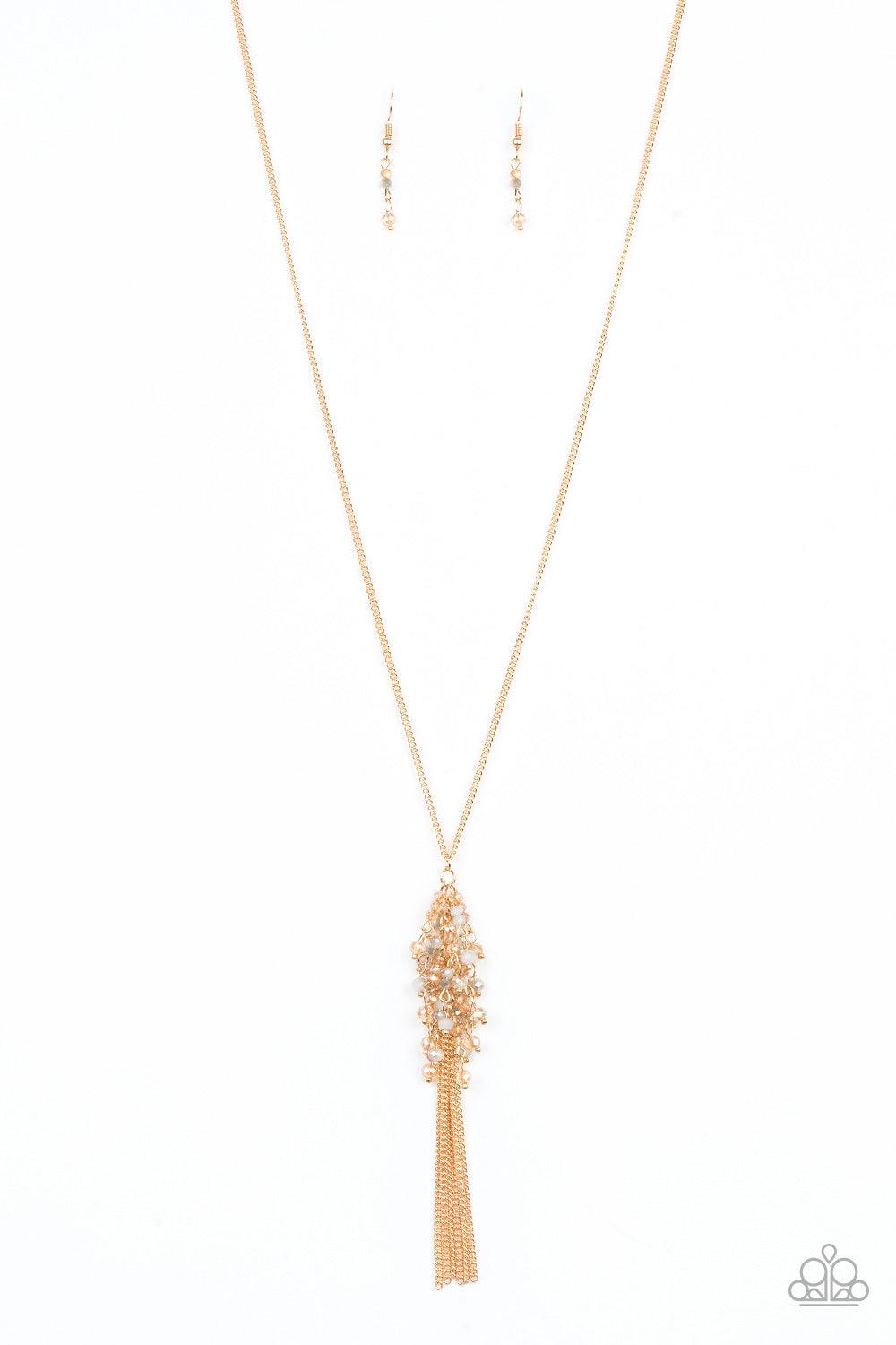 Paparazzi Accessories Twilight Twinkle ~Multi Twinkling gold beads are threaded along dainty gold rods, creating a sparkling fringe at the bottom of a lengthened gold chain. A lobster clasp hangs from the bottom of the design to allow a name badge or othe