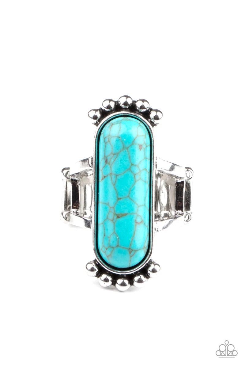 Paparazzi Accessories Ranch Relic - Blue An oblong turquoise stone is pressed into a sleek silver frame featuring a studded top and bottom. The rustic frame sits atop two layered bands, creating a whimsical centerpiece atop the finger. Features a stretchy