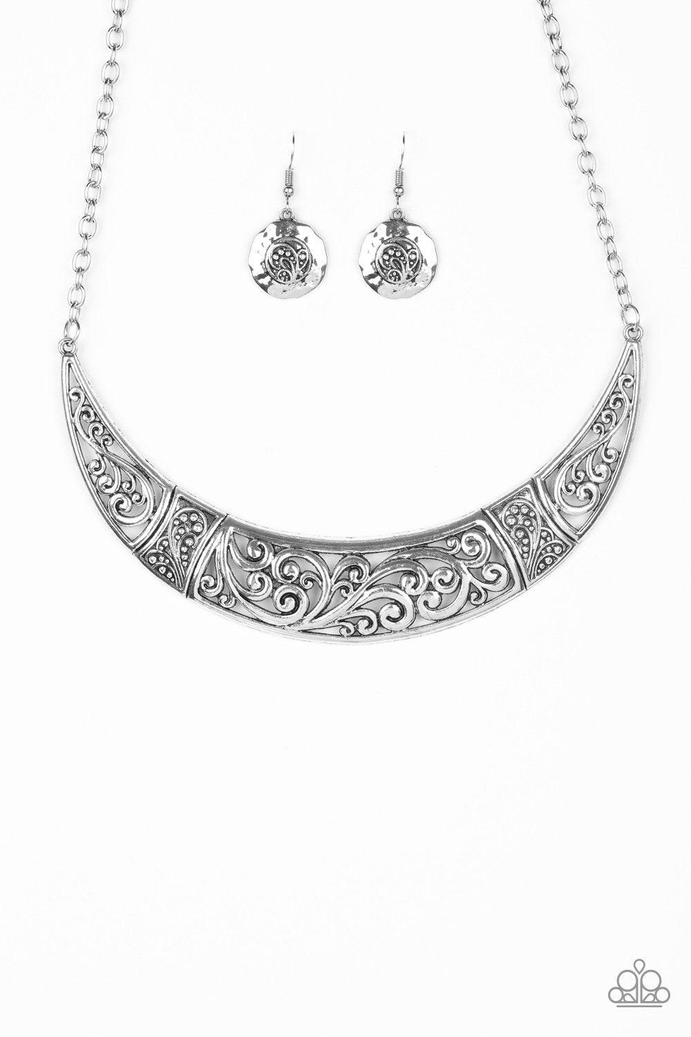 Paparazzi Accessories Bull In A China Shop - Silver Swirling with ornate filigree filled detail, a shimmery silver crescent plate swings below the collar for a fierce look. Features an adjustable clasp closure. Sold as one individual necklace. Includes on