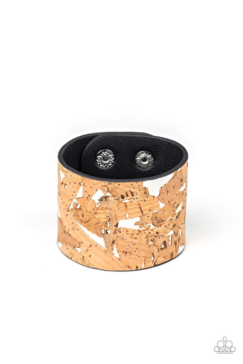 Paparazzi Accessories Cork Congo - White Pieces of cork have been plastered across the front of a shiny white leather band, creating an earthy look around the wrist. Features an adjustable snap closure. Sold as one individual bracelet. Jewelry