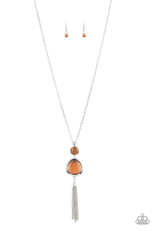 Paparazzi Accessories Have Some Common SENSE! - Orange Swinging from the bottom of a glistening silver chain, glowing stacked moonstone pendants give way to a shimmery silver tassel for a refined look. Features an adjustable clasp closure. Sold as one ind