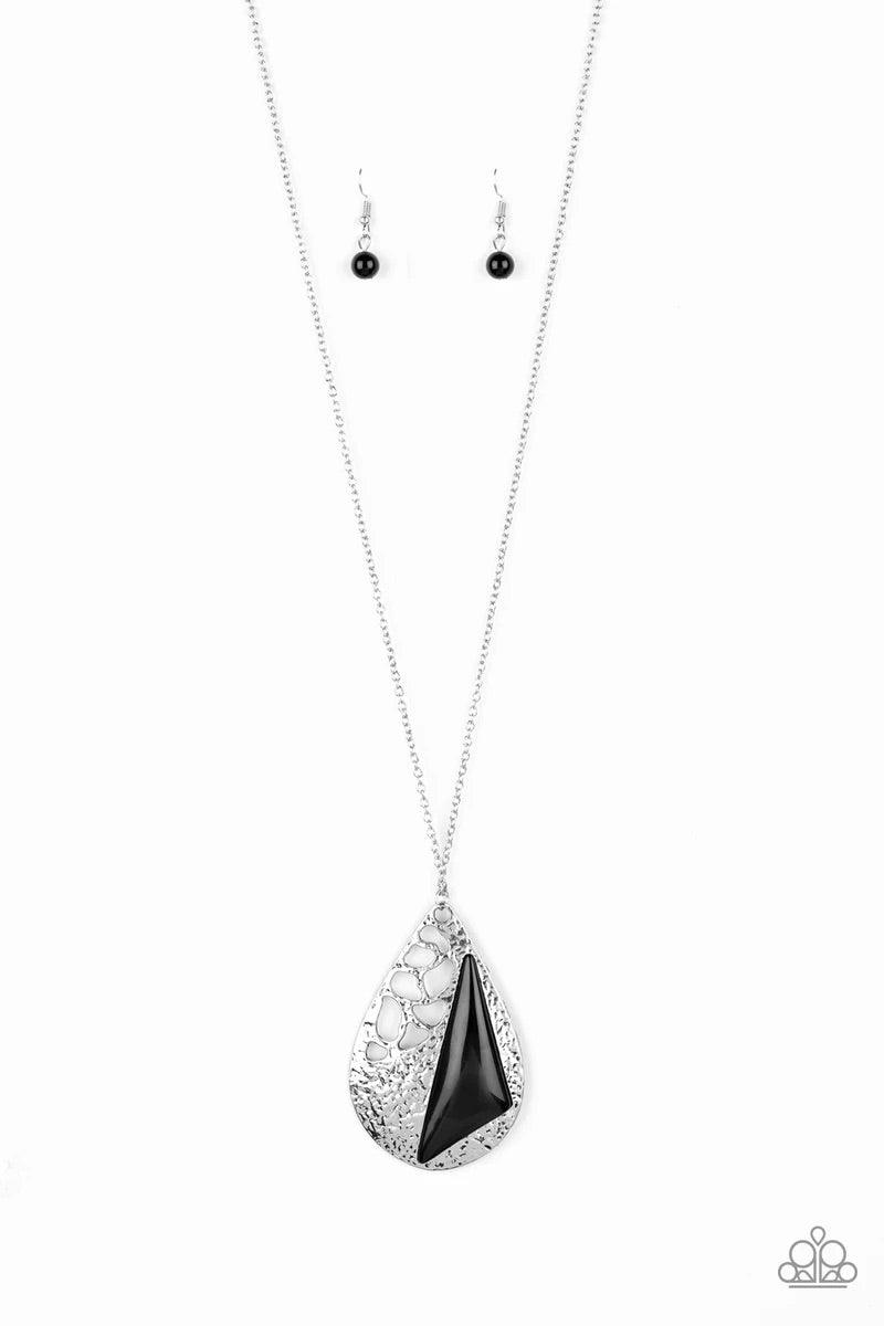Paparazzi Accessories Impressive Edge - Black Featuring a triangular shape, a shiny black bead is pressed into a hammered silver teardrop radiating with airy cut-out patterns for an edgy look. The impressive pendant swings from the bottom of a lengthened