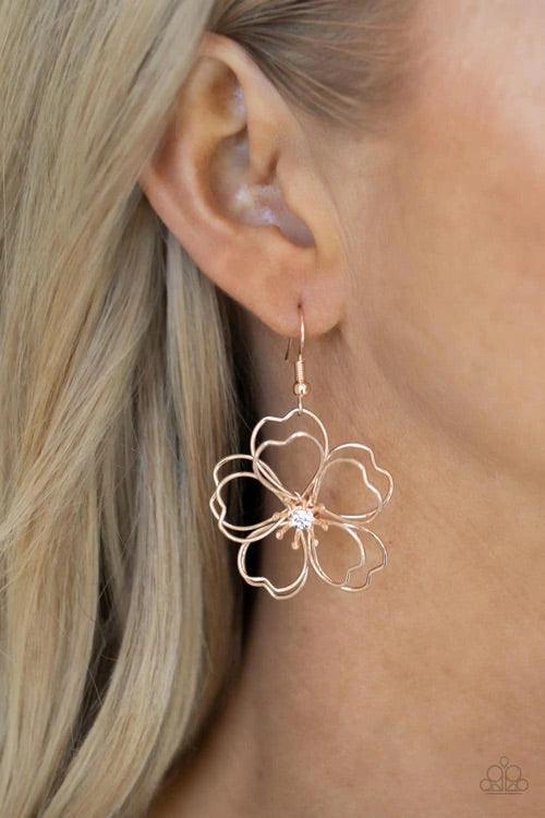 Paparazzi Accessories Petal Power - Rose Gold Layers of heart-shaped petals molded from shiny rose gold wire create an airy three-dimensional flower. A dainty white rhinestone dots the center adding sparkle to the whimsical frame. Earring attaches to a st
