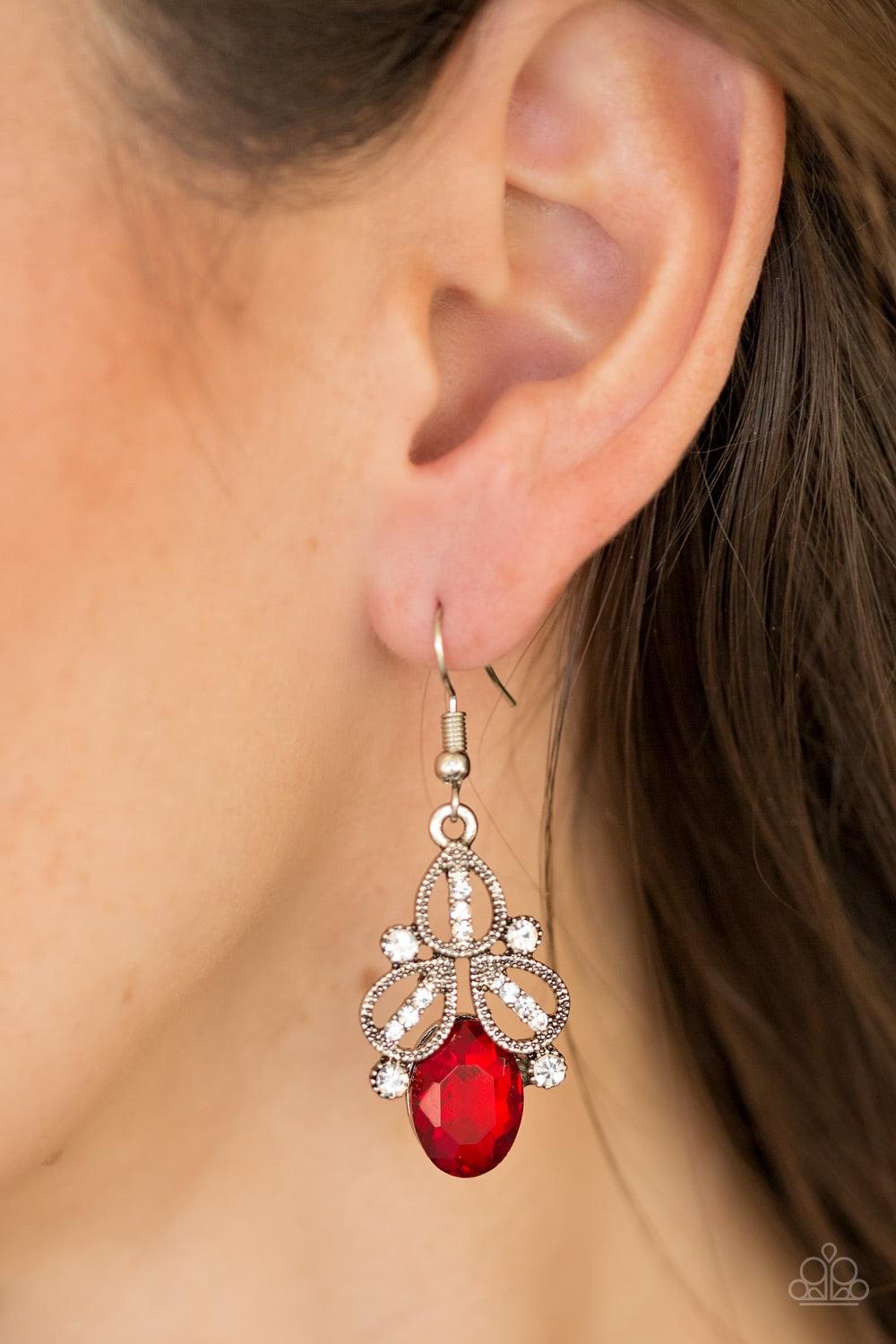 Paparazzi Accessories A CROWN Pleaser - Red Encrusted in dainty white rhinestones, silver teardrop frames stack atop a fiery red gem for a regal look. Earring attaches to a standard fishhook fitting. Jewelry