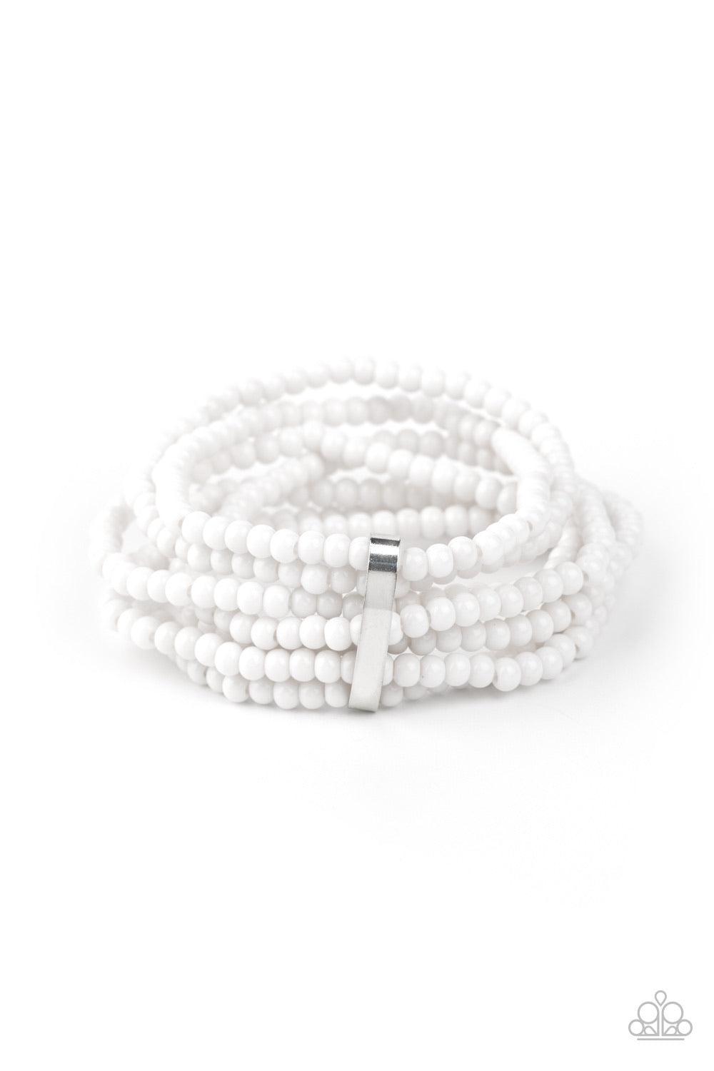 Paparazzi Accessories Thank Me LAYER - White Held together by a dainty silver fitting, a casual collection of white beads are threaded along stretchy bands around the wrist, creating colorful layers. Sold as one individual bracelet. Jewelry
