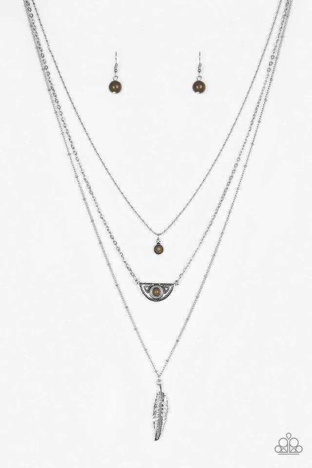 Paparazzi Accessories Sahara Sparrow - Green Featuring indigenous inspired pendants, mismatched silver chains layer down the chest for a seasonal look. Featuring earthy green beaded accents, dainty silver frames give way to a lifelike silver feather penda