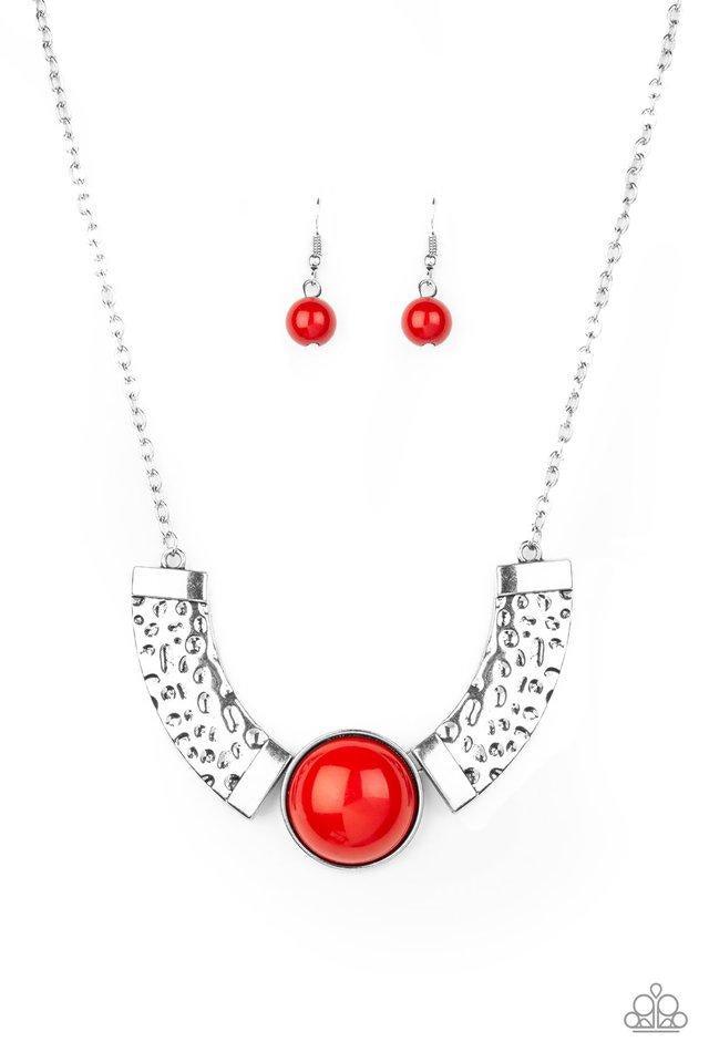 Paparazzi Accessories Egyptian Spell - Red Dramatic silver plates connect with a shiny red beaded center, creating an indigenous collar-like pendant. The shiny silver plates are delicately hammered, adding a flashy metallic texture to the tribal inspired