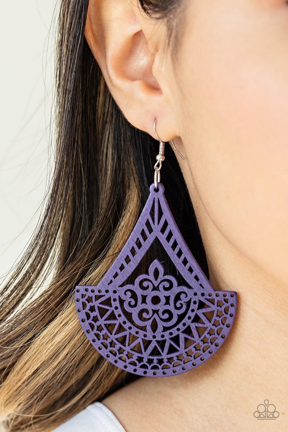 Paparazzi Accessories Tiki Sunrise - Purple Stenciled in an airy wooden filigree pattern, a decorative purple frame swings from the ear for a seasonal look. Earring attaches to a standard fishhook fitting. Jewelry