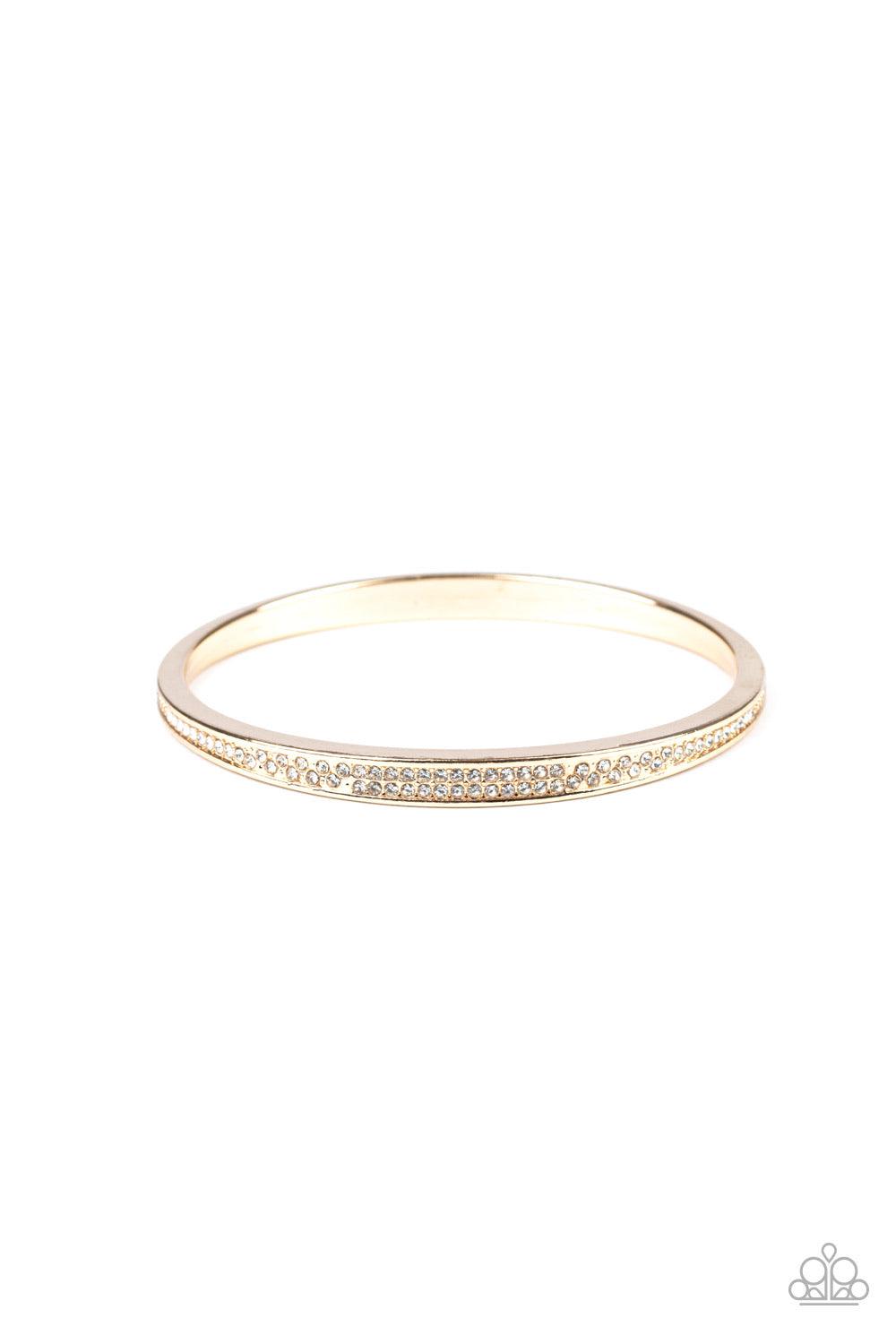 Paparazzi Accessories Power Move - Gold Rows of dainty white rhinestones have been encrusted along the front of a thick asymmetrical gold bangle for a timeless twist. Sold as one individual bracelet. Jewelry