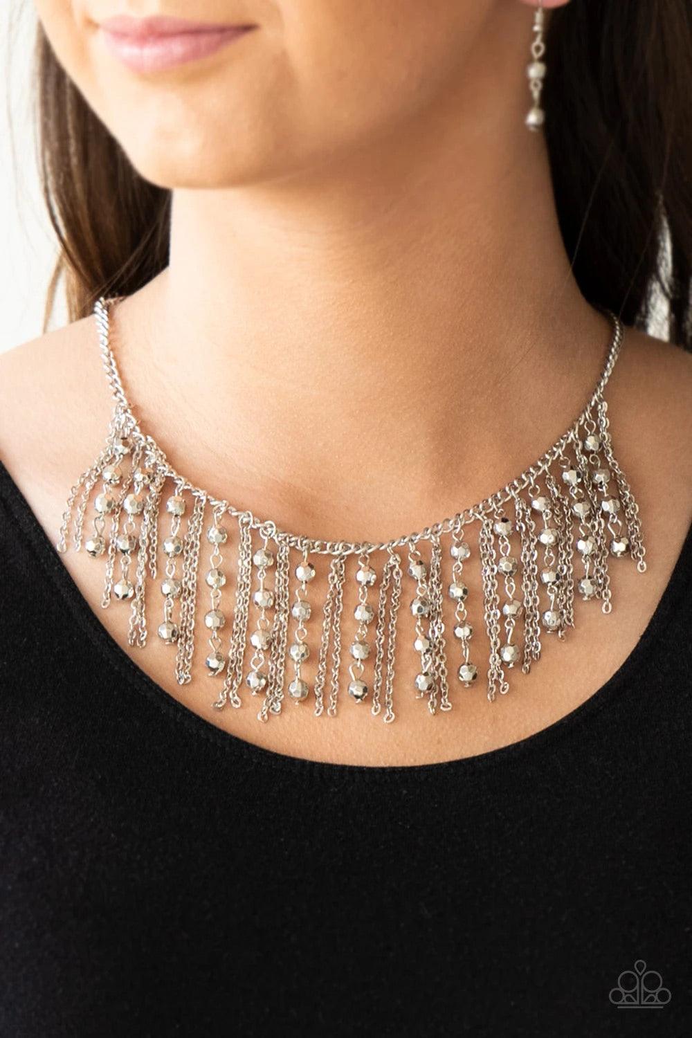 Paparazzi Accessories Rebel Remix - Silver Stands of faceted silver beads and glistening silver chains stream from a matching silver chain, creating an edgy fringe below the collar. Features an adjustable clasp closure. Sold as one individual necklace. In