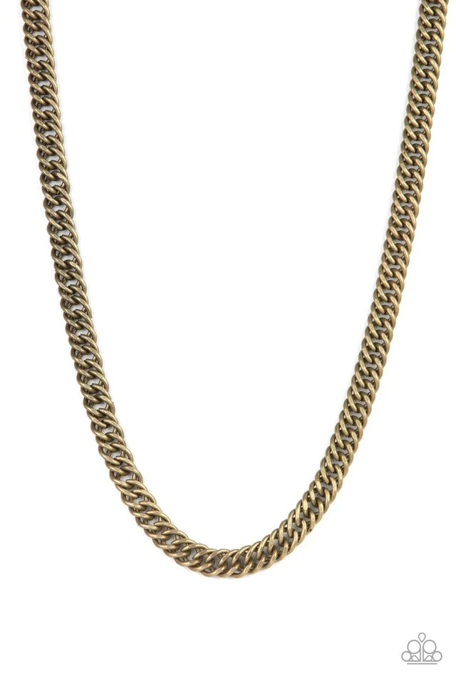 Paparazzi Accessories Winner’s Circle - Brass A soft matte finish creates a natural earthy look on a strand of uniquely faceted asymmetrical brass links. The flattened chain falls across the chest for an unapologetic industrial effect. Features an adjusta