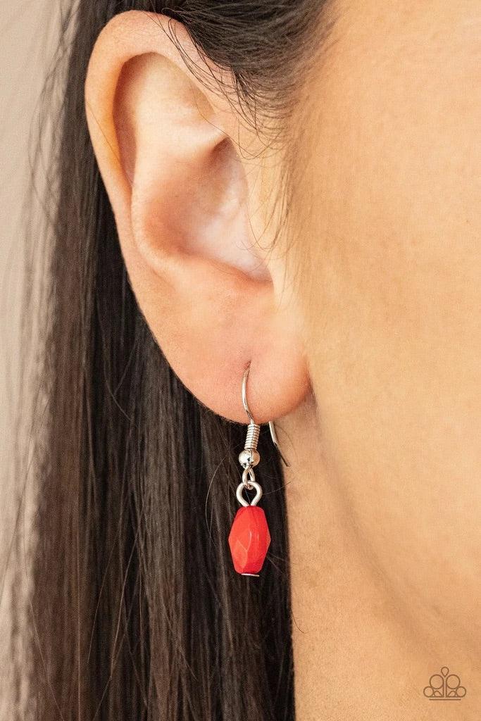 Paparazzi Accessories Glossy Glamorous - Red Featuring glassy, polished, and opaque finishes, a faceted collection of red beads join hammered silver discs along a shiny silver chain, creating a colorful display across the chest. Features an adjustable cla