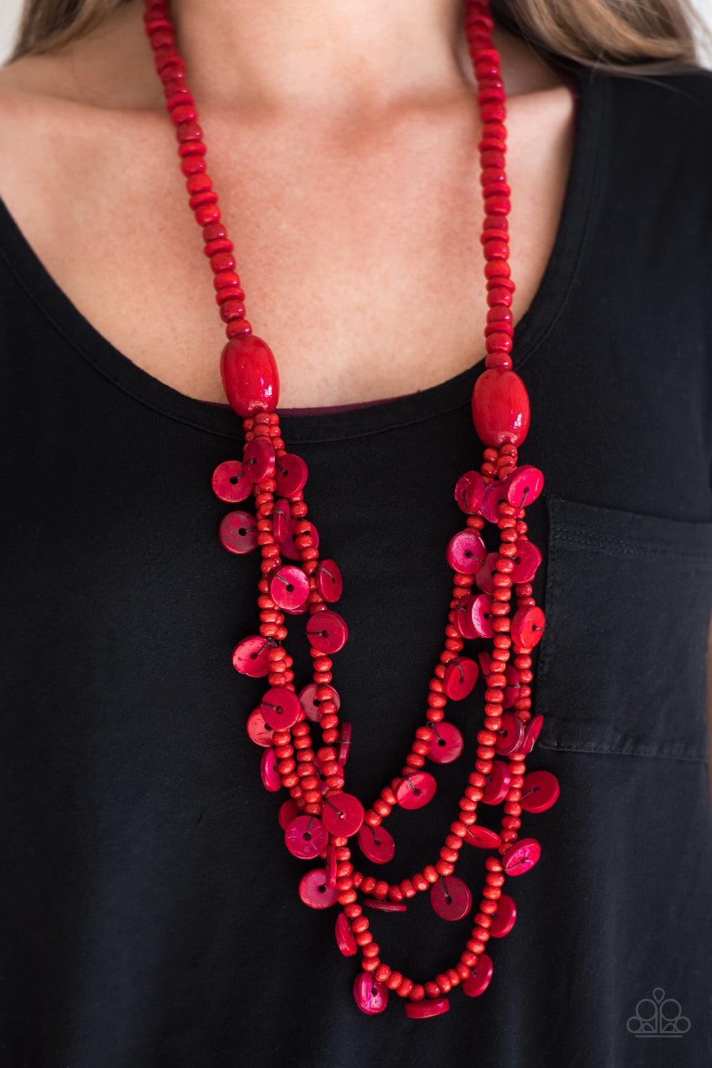 Paparazzi Accessories Safari Samba - Red Brushed in a fiery red finish, two bold wooden beads give way to summery layers. Brushed in a distressed finish, dainty wooden discs swing from the bottom of the layers for a flirty finish. Jewelry