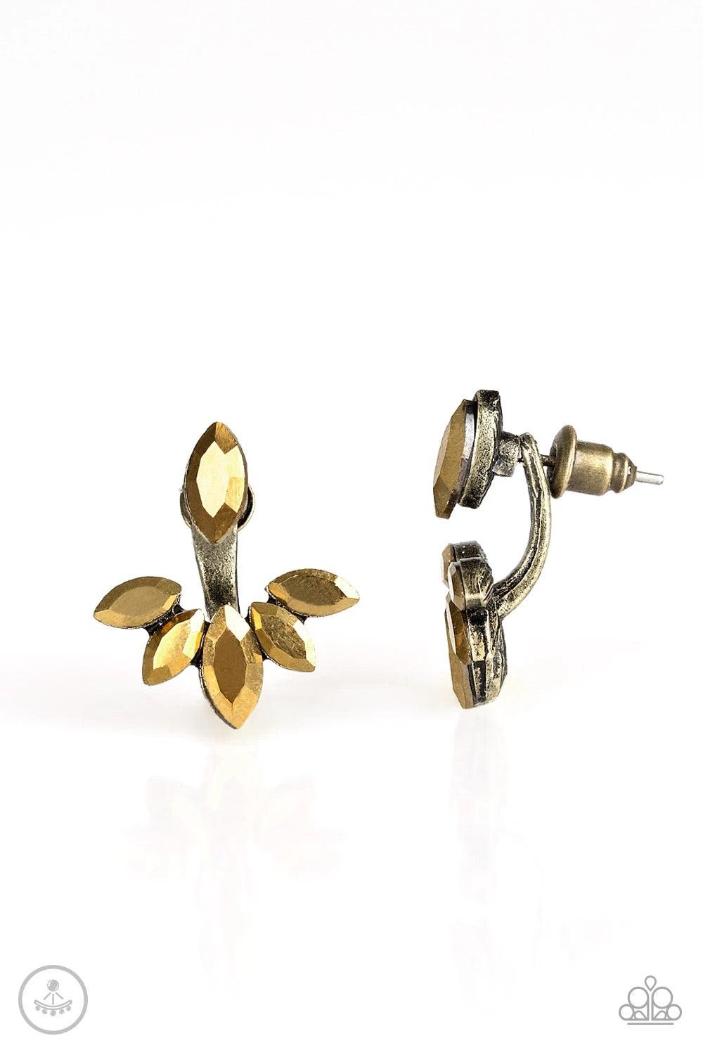 Paparazzi Accessories Radical Refinement - Brass A solitaire aurum marquise cut rhinestone attaches to a double-sided post, designed to fasten behind the ear. Encrusted in matching aurum rhinestones, a double-sided post peeks out beneath the ear, creating