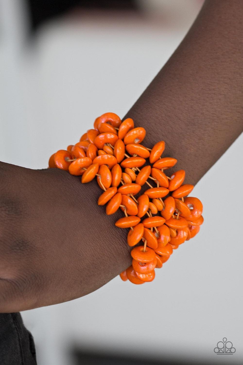 Paparazzi Accessories Hawaii Haven - Orange Vivacious orange wooden accents are threaded along elastic stretchy bands, creating summery floral patterns across the wrist for a seasonal look. Jewelry