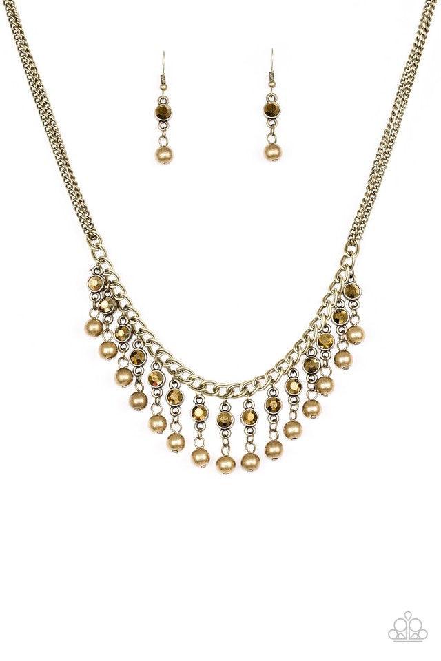 Paparazzi Accessories Pageant Queen - Brass Sparkling aurum rhinestones drip from the bottom of a bold brass chain. Classic brass beads swing from the bottoms of the glittery rhinestones, creating a glamorous fringe below the collar. Features an adjustabl