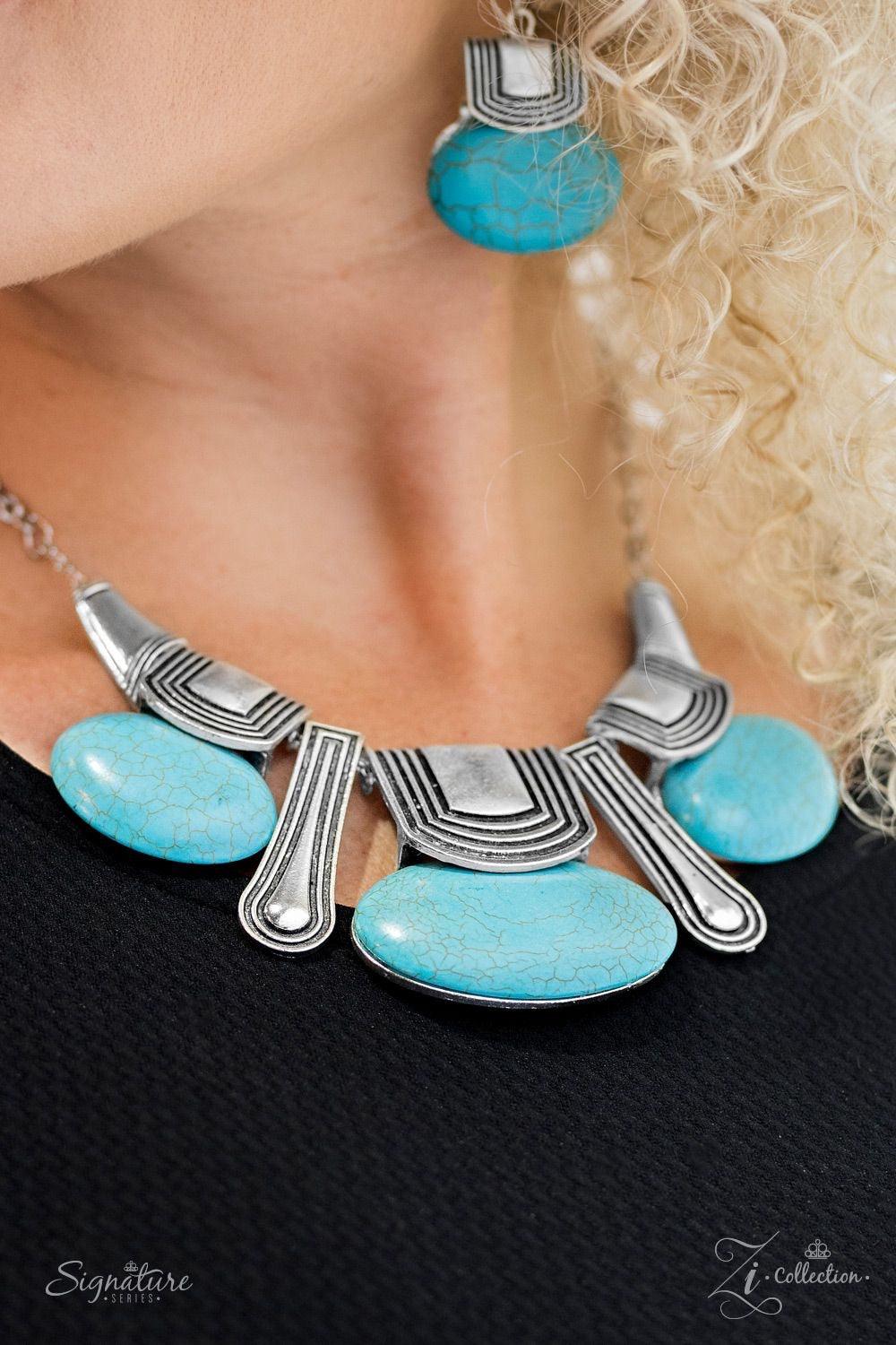 Paparazzi Accessories The Rhonda Oval shaped turquoise stones swing from the bottom of textured silver frames, creating an earthy fringe below the collar. Brushed in an antiqued shimmer, silver plates drip between the refreshing stone beading for a bold a