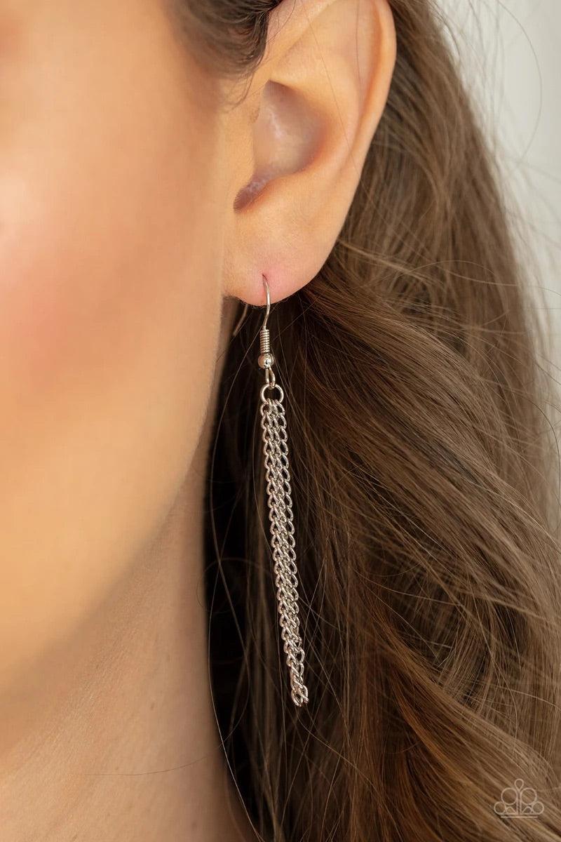 Paparazzi Accessories One Night in Casablanca - Pink Flecked in glittery pink sparkles, a scalloped cork frame is pressed into a sleek silver frame at the bottom of a dainty silver satellite chain. A classic silver chain tassel swings from the whimsical p