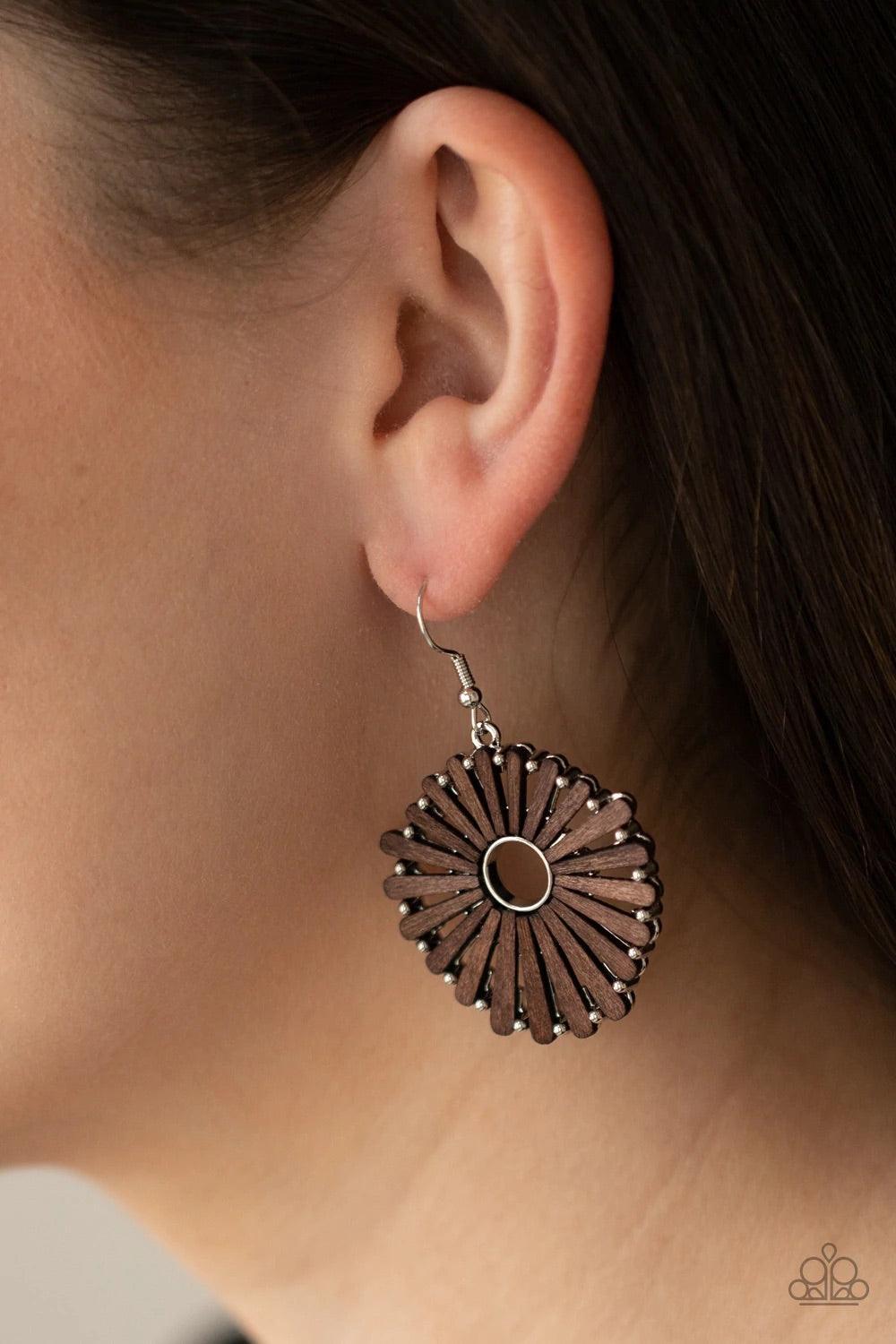 Paparazzi Accessories Spoke Too Soon - Brown Petal-like wooden frames asymmetrically flare out from an airy silver center, creating a rustic floral display. Earring attaches to a standard fishhook fitting. Sold as one pair of earrings. Jewelry